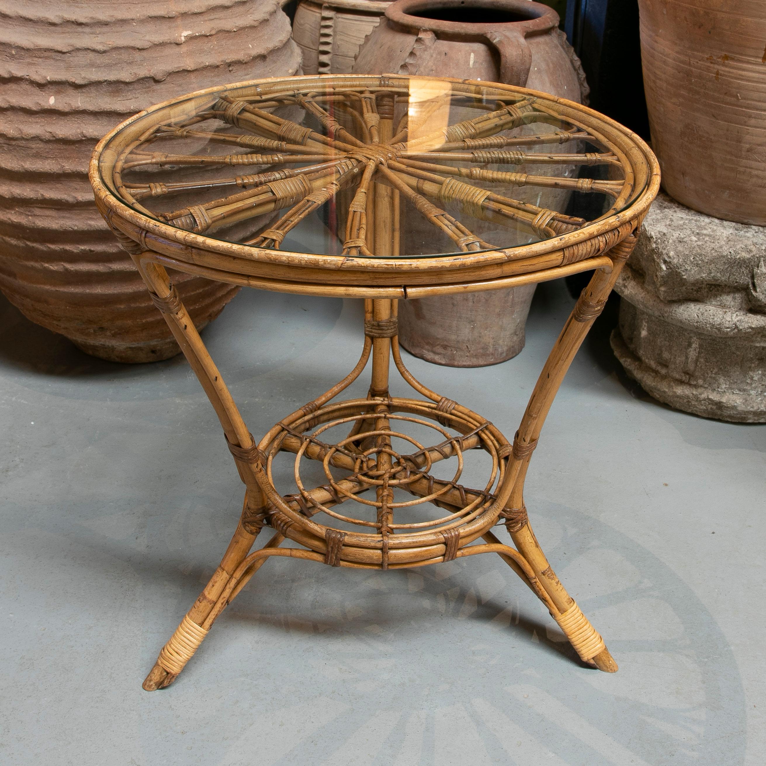 Vintage 1970s Spanish round bamboo and woven wicker table.