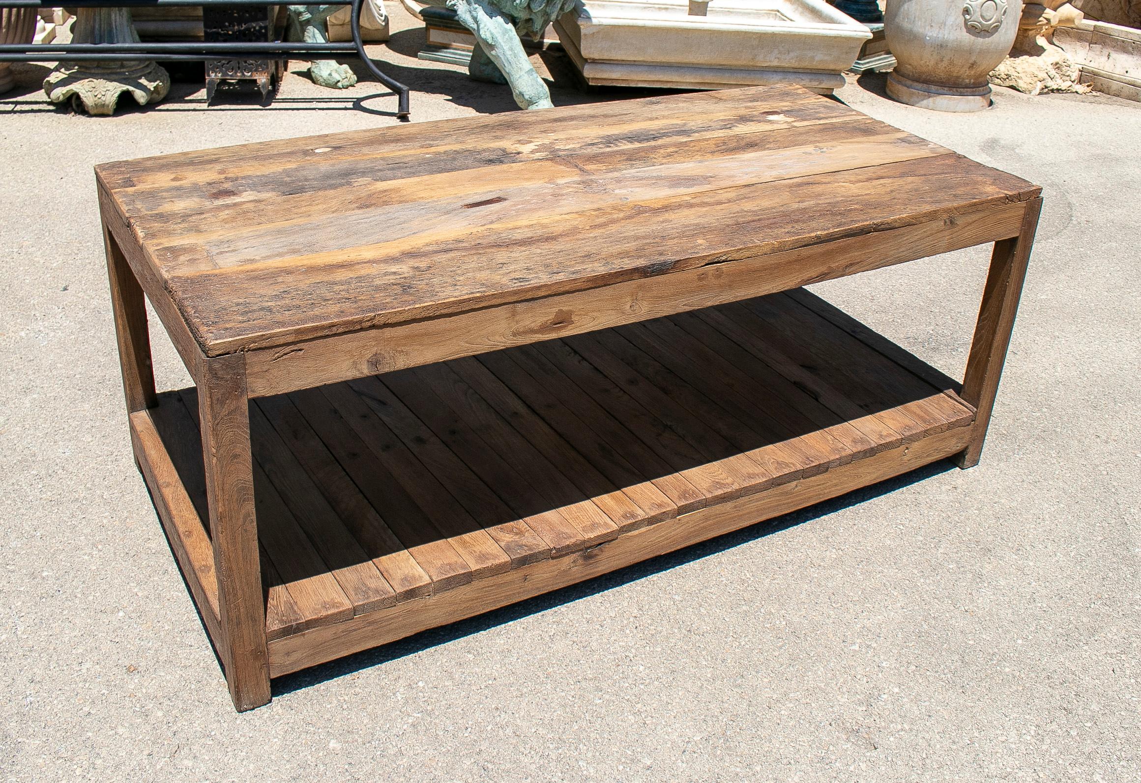 Rustic coffee table. A 1970s Spanish washed wood farmhouse low table with bottom shelf.