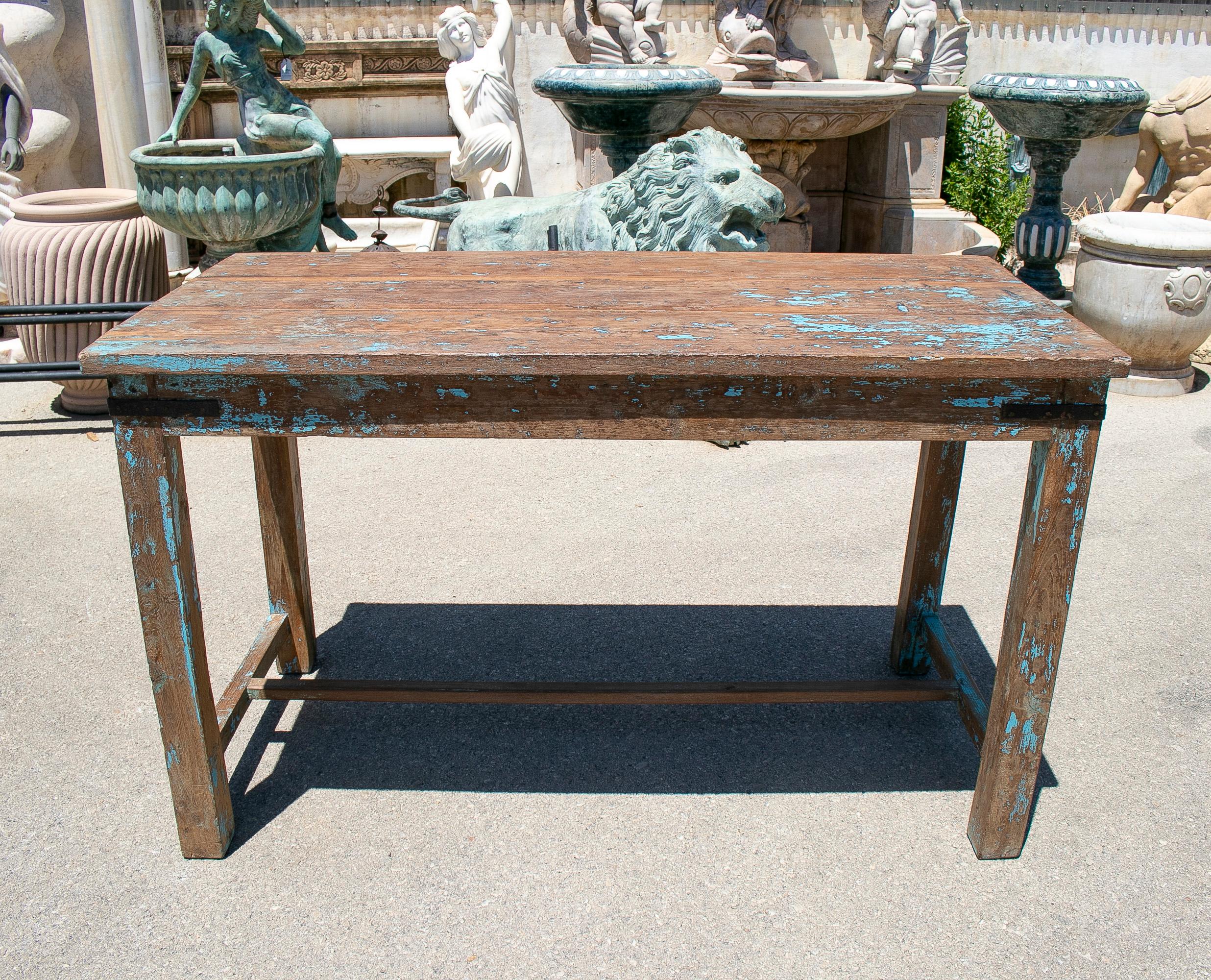 Rustic 1970s Spanish washed wood farmhouse table with crossbeam.