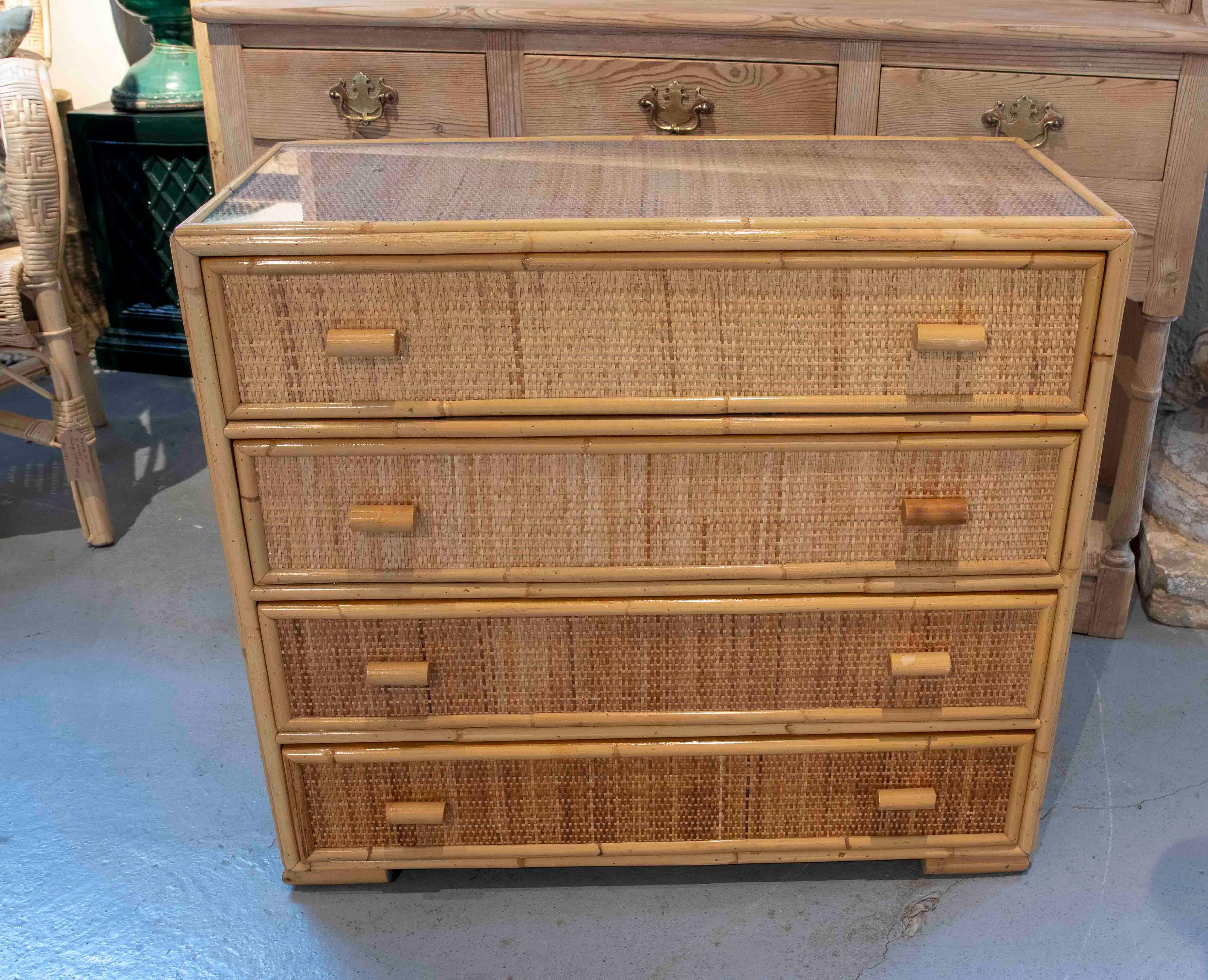 1970s Spanish Wicker chest of drawers with three drawers and flass top.