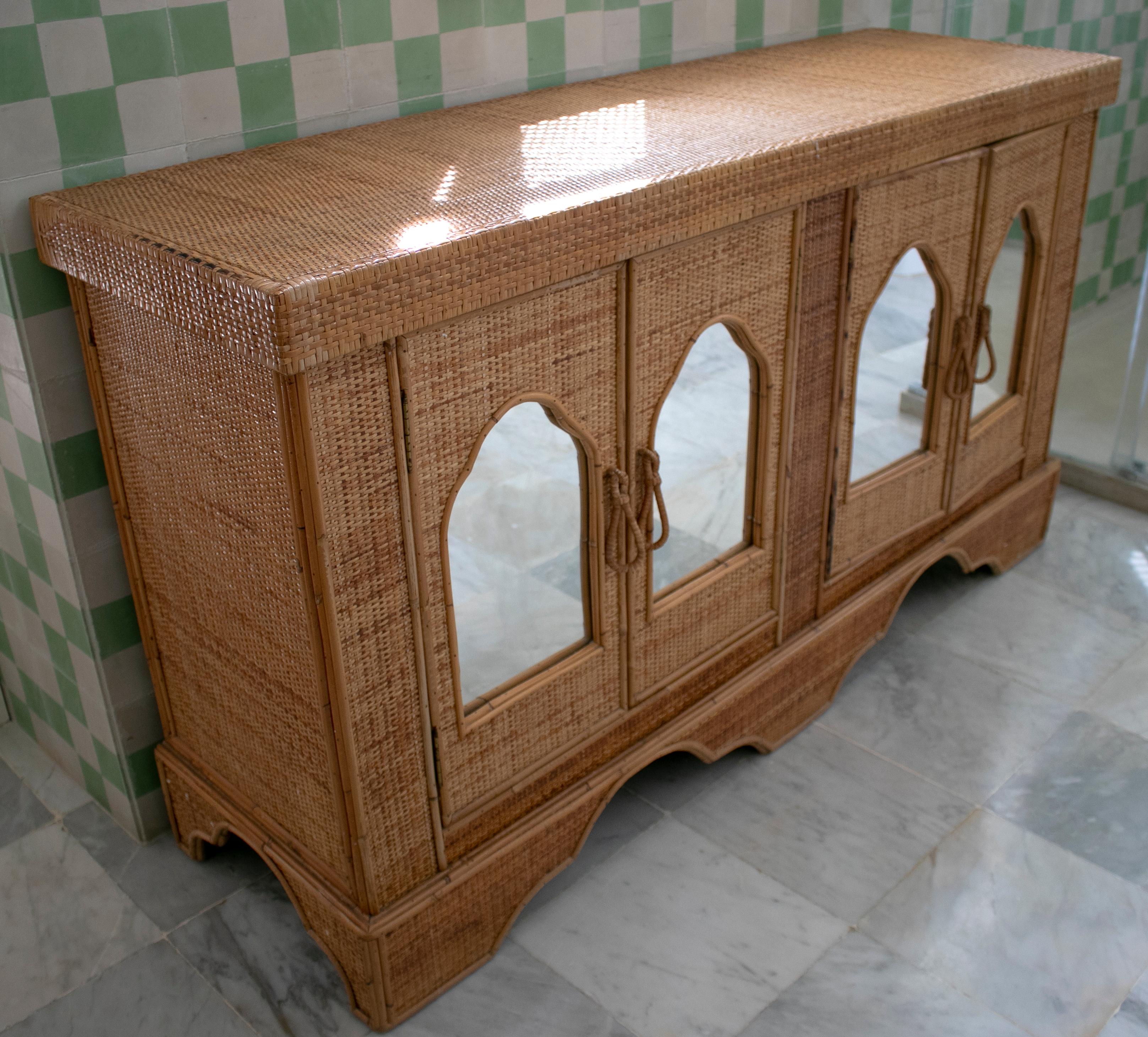 1970s Spanish wicker four-door sideboard with drawers.