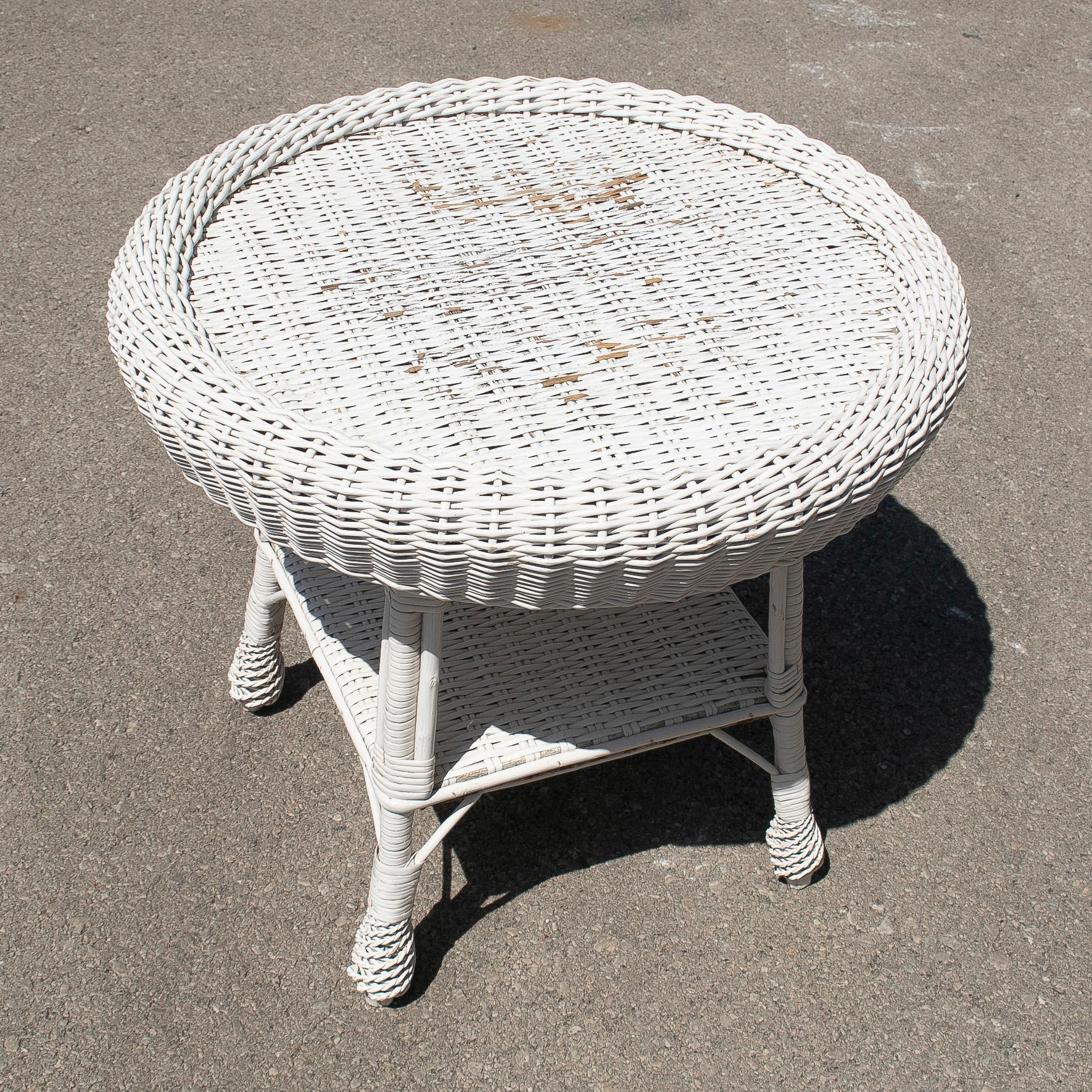 Vintage 1970s Spanish hand woven wicker round side table.
