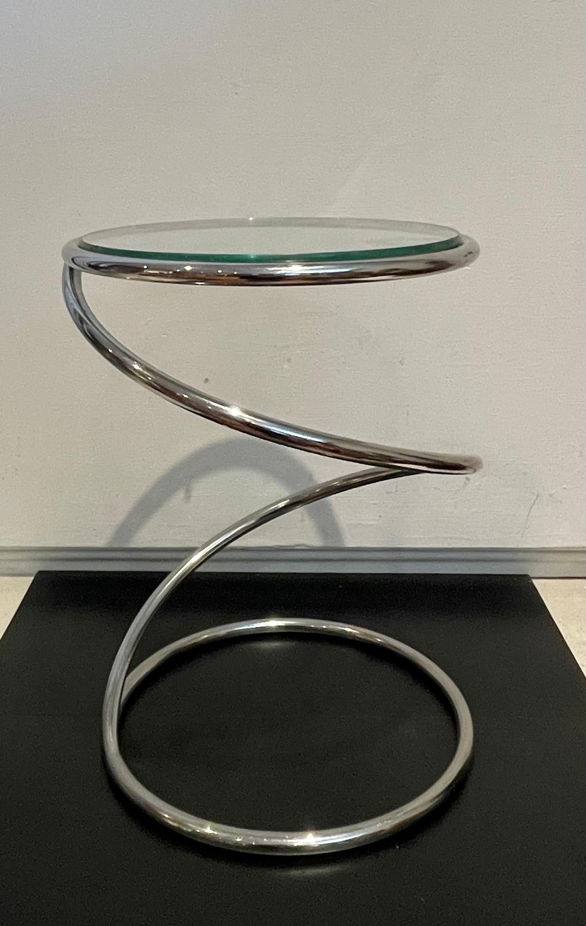 Simple elegant single cocktail table designed by Leon Rosen for Pace furniture, in polished chrome and glass.