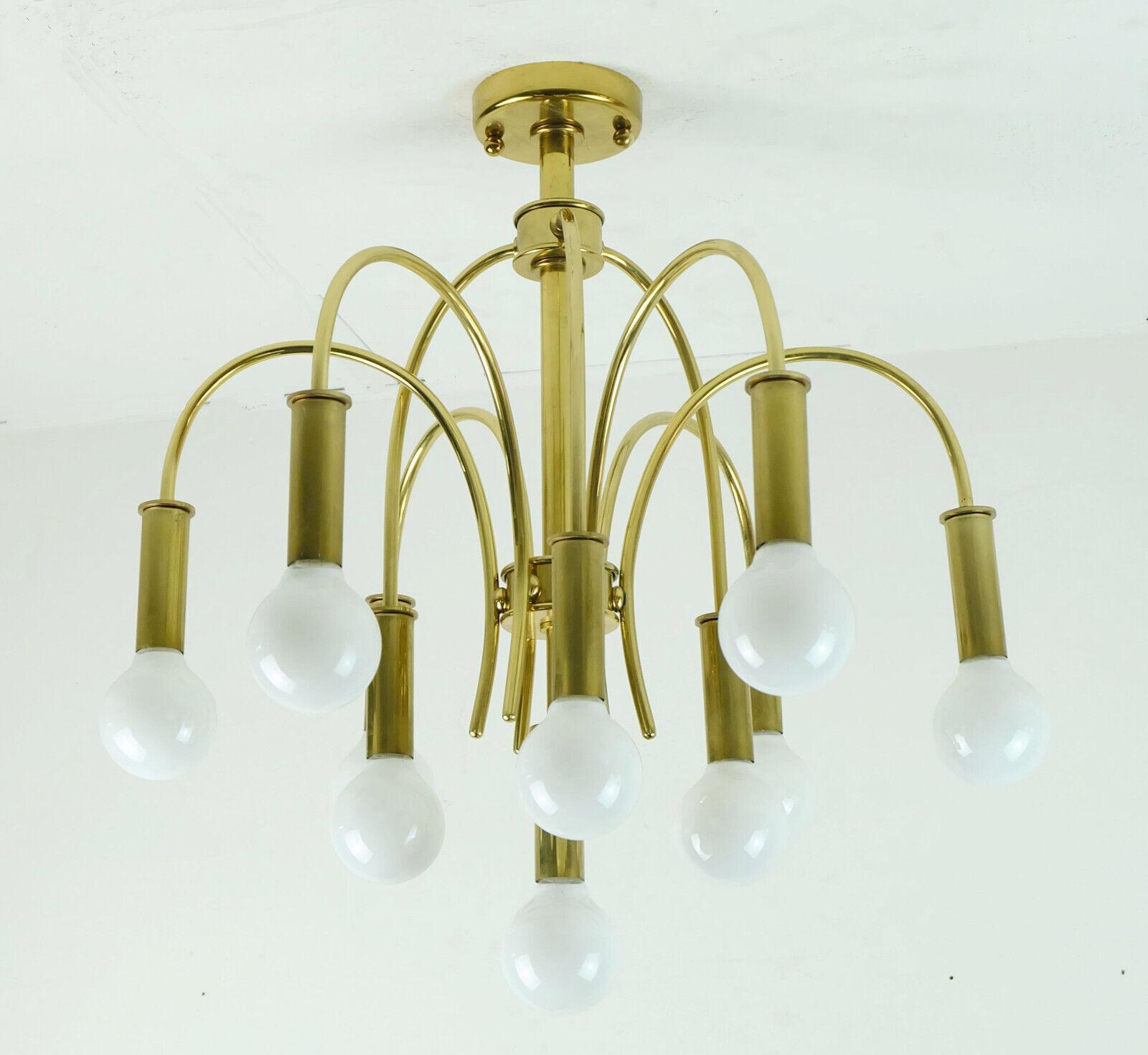 Fantastic large Sputnik ceiling lamp by Schröder & Co., manufactured in the 1970's. The lamp is made of brass, it has 10 curved arms that are placed at different heights.
Holds 10 E14 bulbs (bulbs on the pictures are not included in the