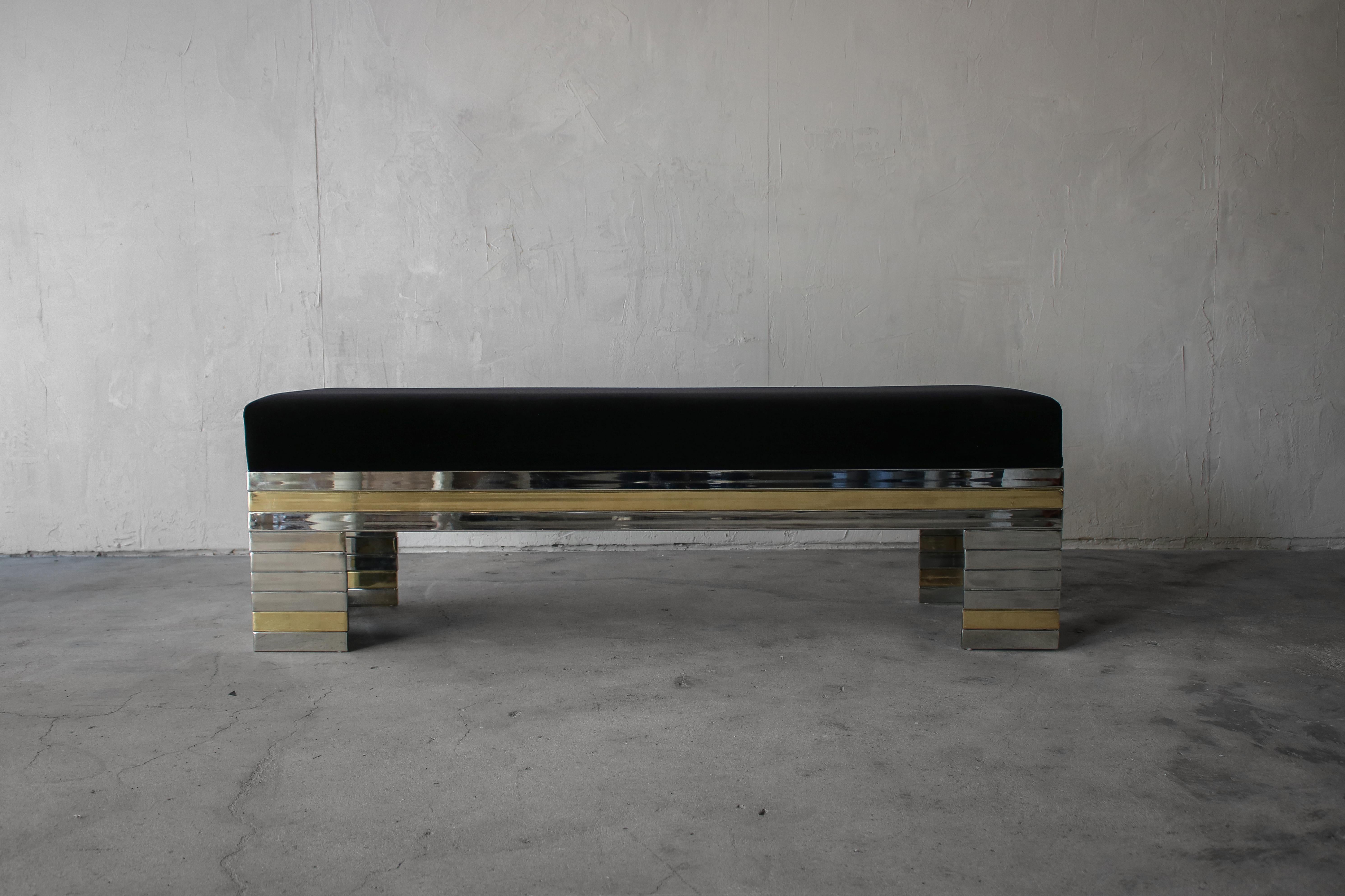 Absolutely stunning stacked, mirrored chrome and brass bench. The bench is authentic vintage, from the 1970s. This bench is beautiful and adds so much class to any space. It is perfect almost anywhere, entry, foot of a bed or as additional seating
