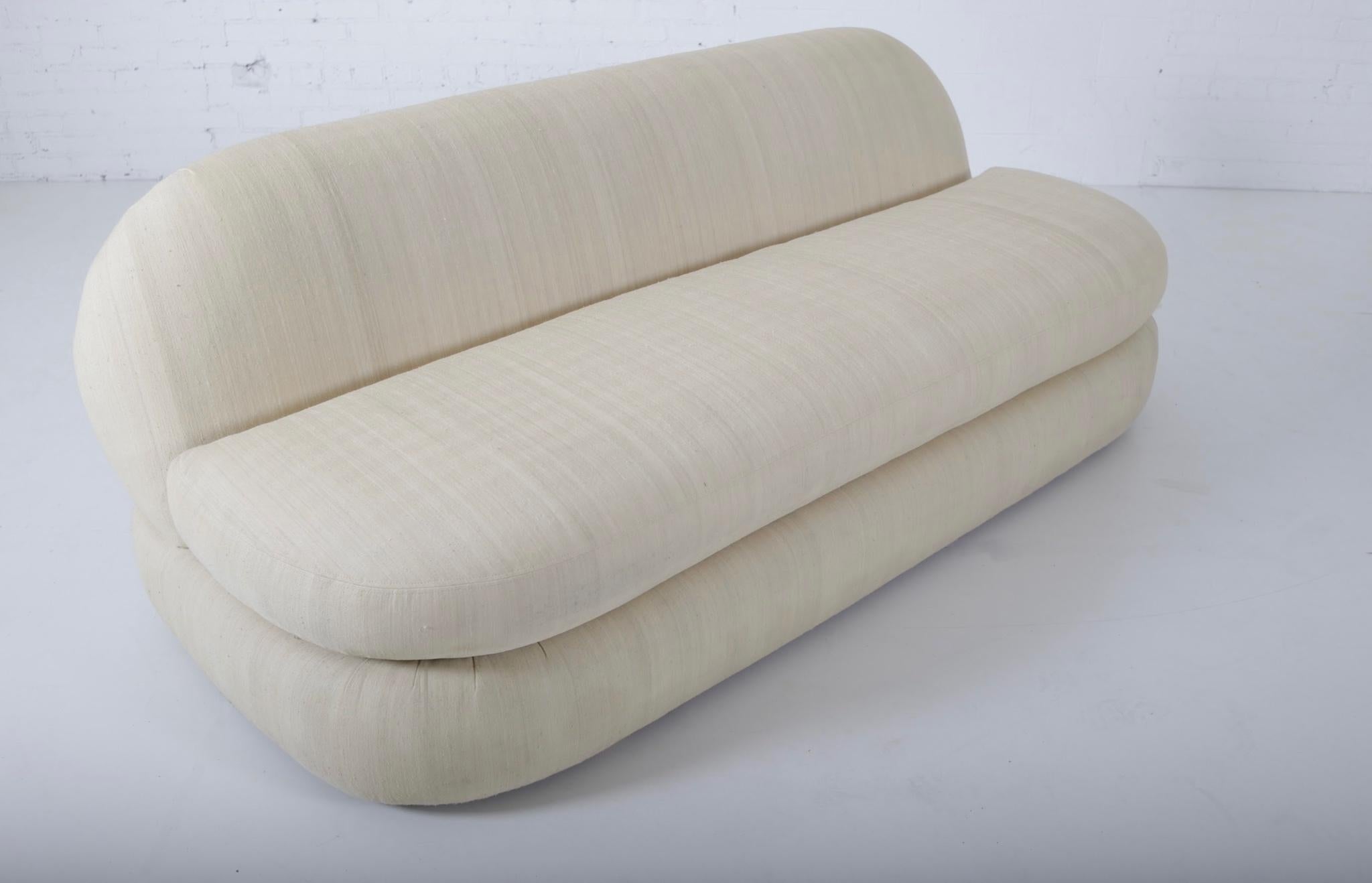 Chic 1970s slipper sofa with stacked cushion form. Original raw silk upholstery.

     