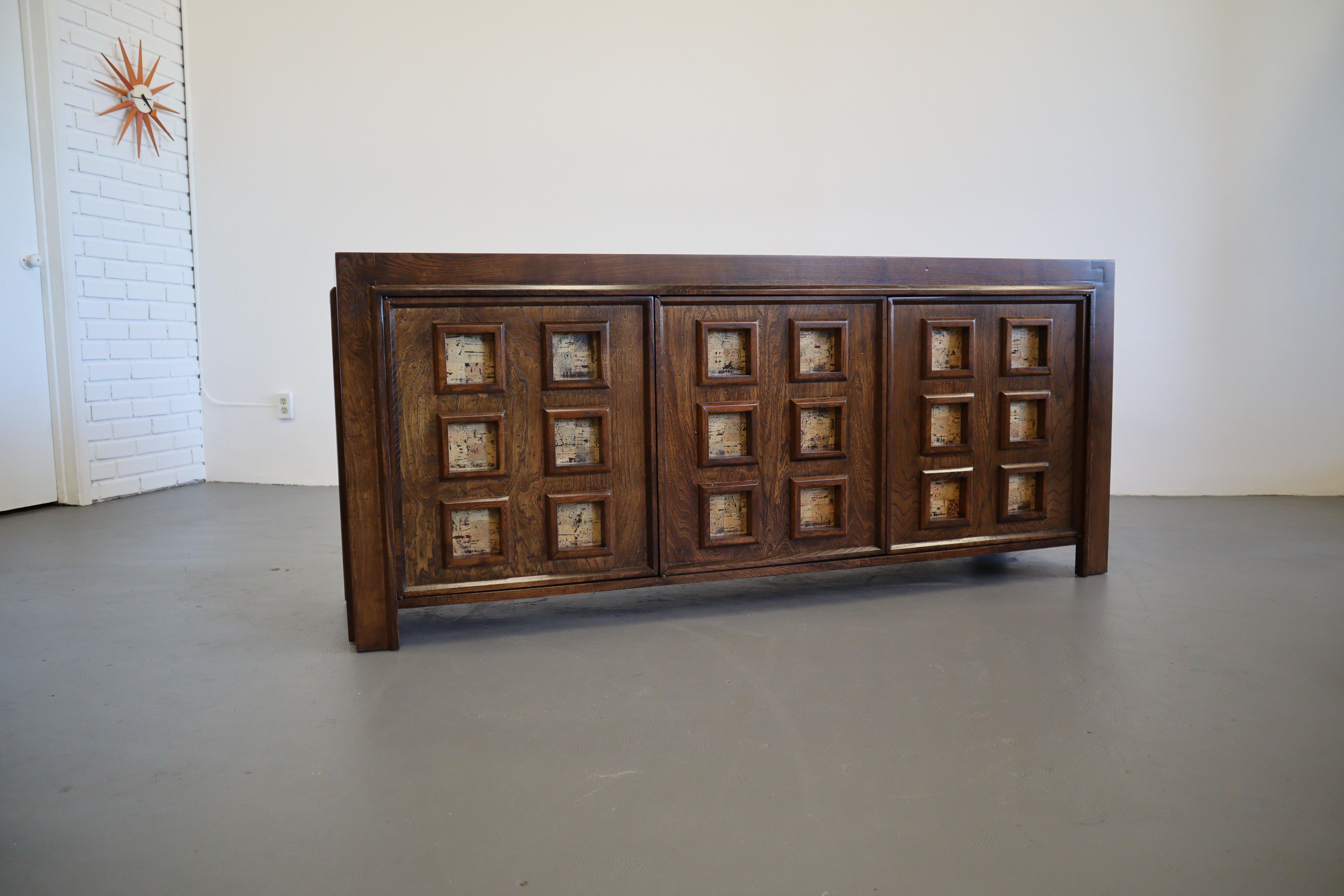 A grand stained oak credenza with geometric cork inserts. Beautifully arranged parquet top surface is elegant and refined. This 70's brutalist is a masterpiece of functionality and design.