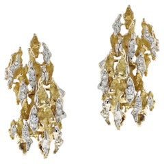 1970s Sterlé Yellow and White Gold Wavy Earrings with Diamonds