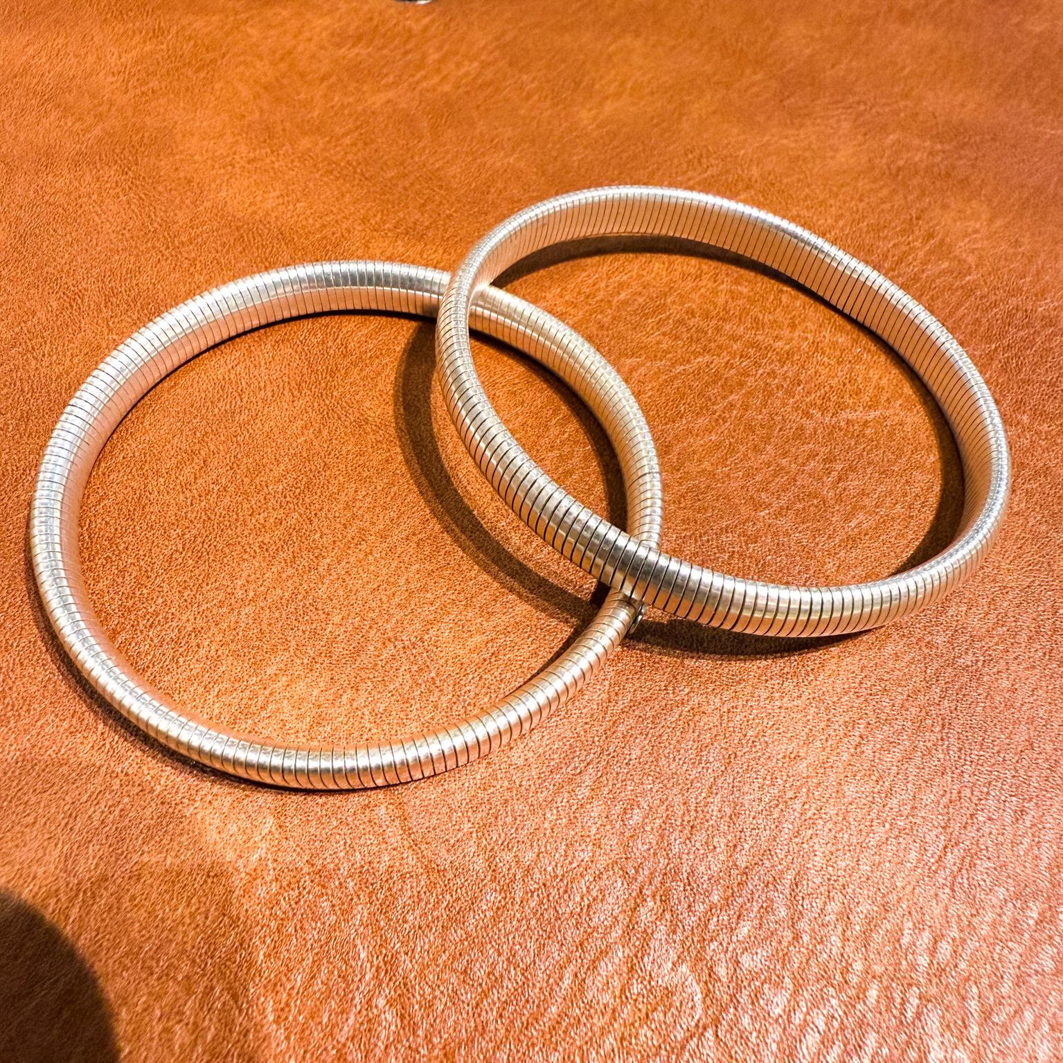 Two Sterling Silver Bracelets Stretch Flex
2.25 diameter (flexible) x .25 w
stamped 925
Preowned vintage condition
Refer to images