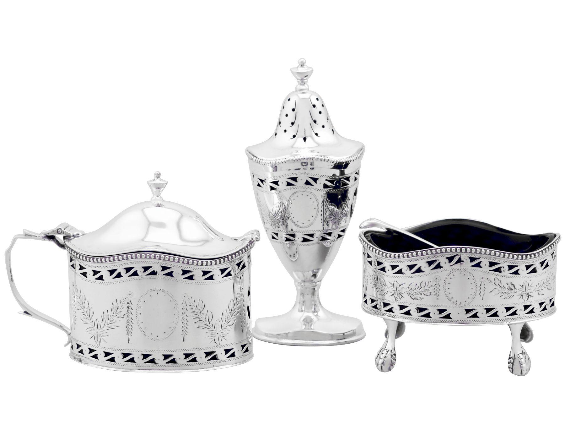 An exceptional, fine and impressive vintage Elizabeth II English sterling silver three piece condiment set - boxed; an addition to our dining silverware collection.

This exceptional vintage Elizabeth sterling silver three piece condiment set