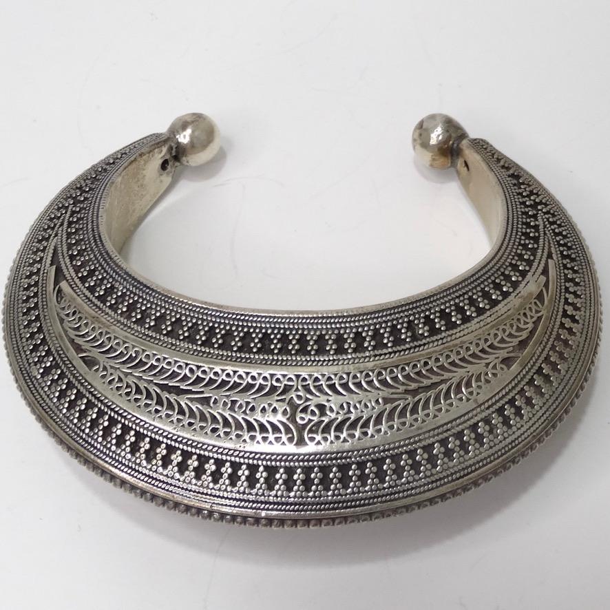 Beautiful sterling silver arm cuff with geometric engravings circa 1970s. This bracelet is so detailed and stunning, look closely at the engravings and notice all of the different patterns and shapes that come together to create this beautiful