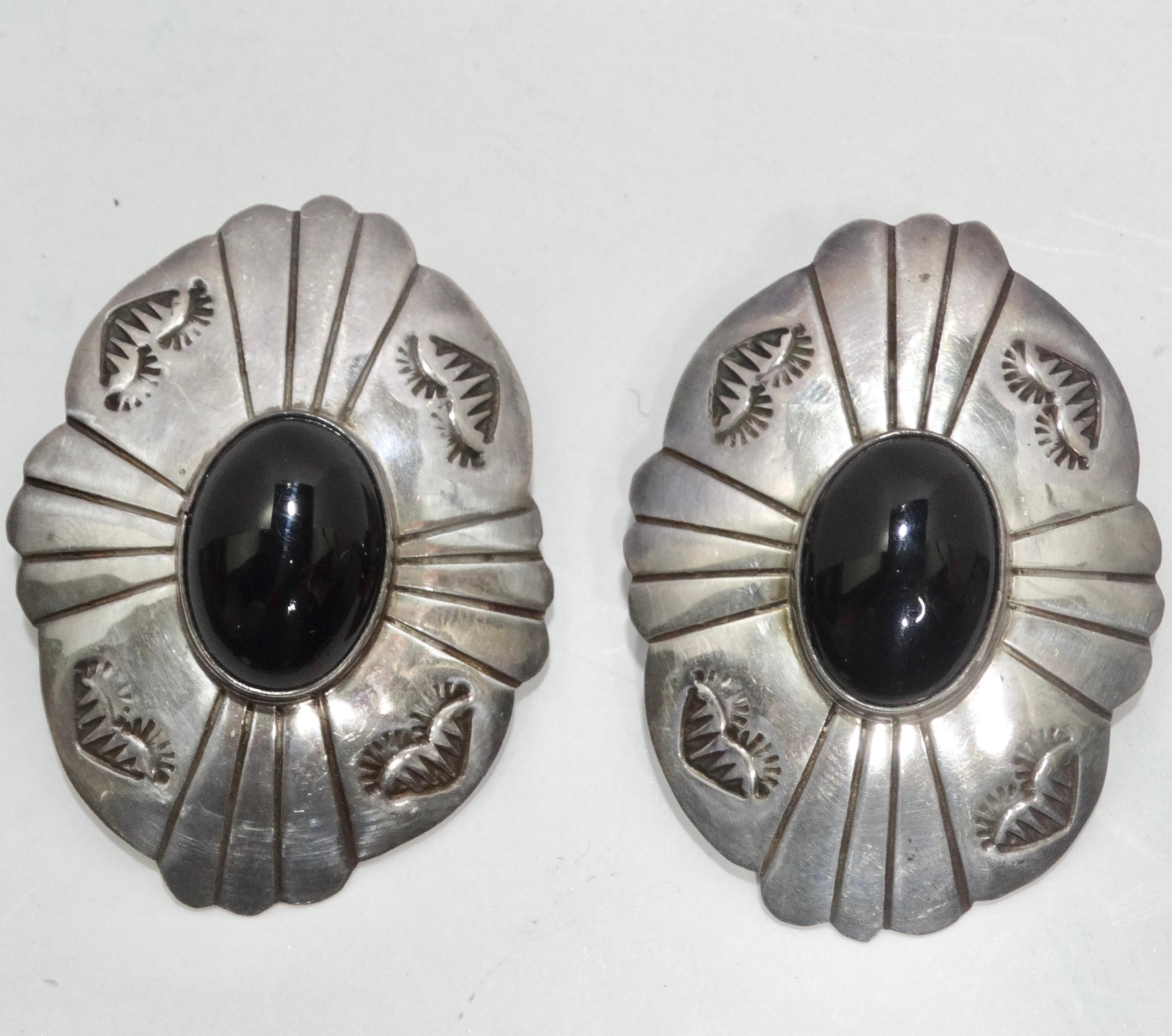 Introducing the 1970s Silver Onyx Statement Earrings—a pair of earrings that effortlessly blend timeless elegance with eye-catching allure. These earrings aren't just accessories; they are wearable pieces of art that capture the essence of vintage