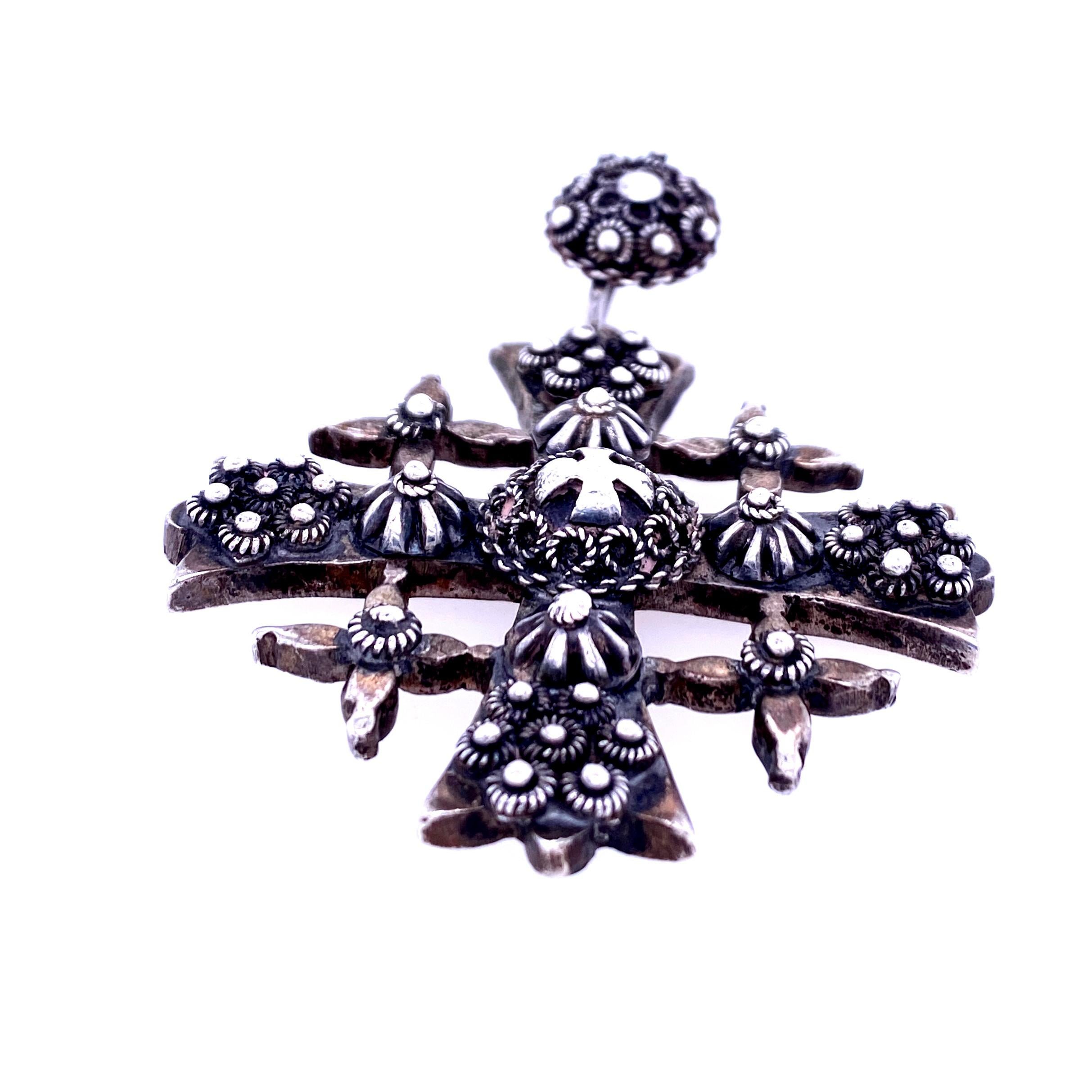 One sterling silver (stamped JERUSALEM 925) textured cross pendant measuring 2.5 inches long with bail x 2 inches wide.  Circa 1970s.