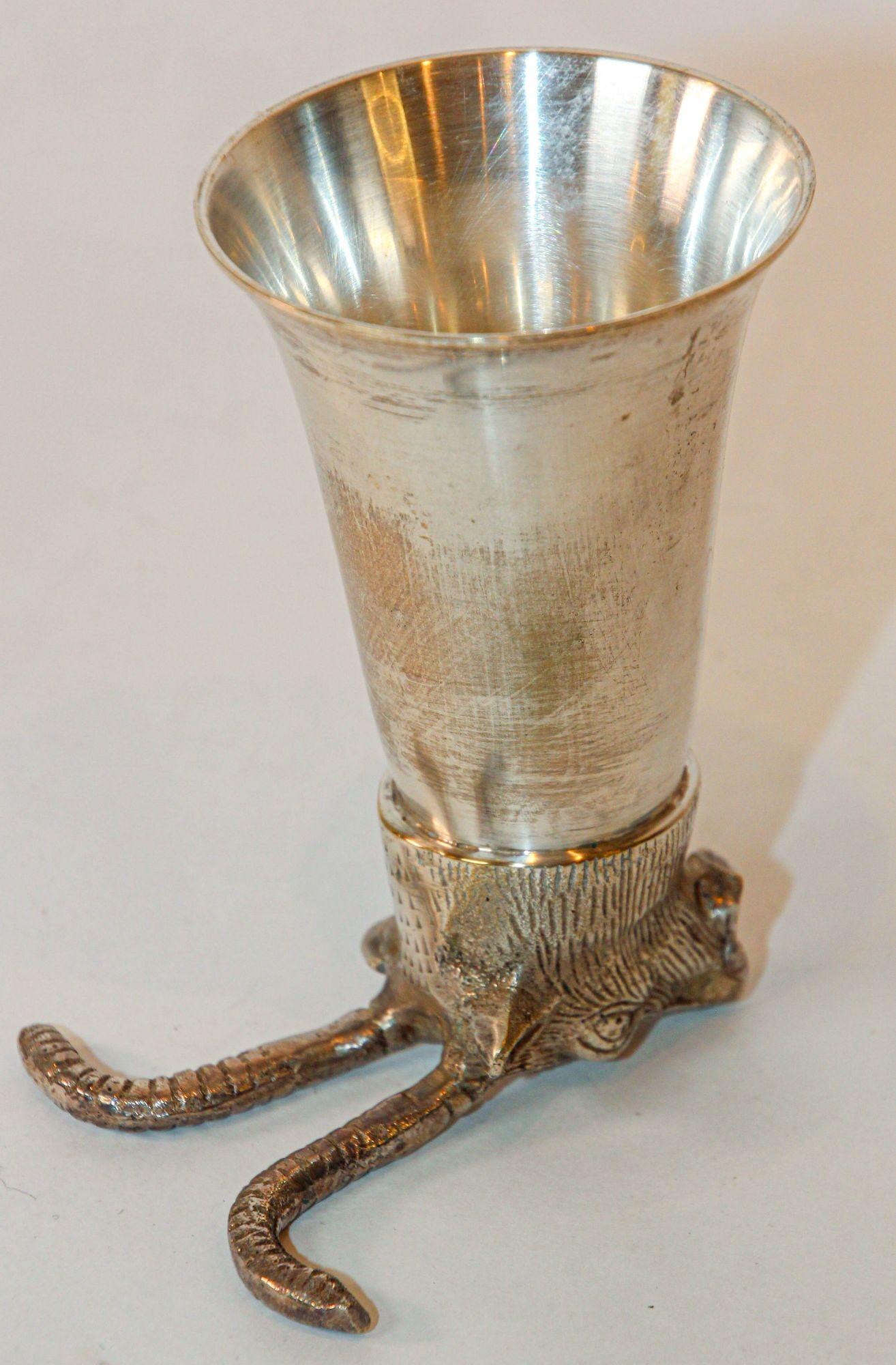Vintage Silver Stirrup Cup Goblet Antelope Head Hunting Equestrian Barware Decor 1970s.
1970s Stirrup Cup With The Head of A Deer or Antelope.
Silver plated deer head with antlers stirrup cup.
The stirrup cup can be displayed on their base and