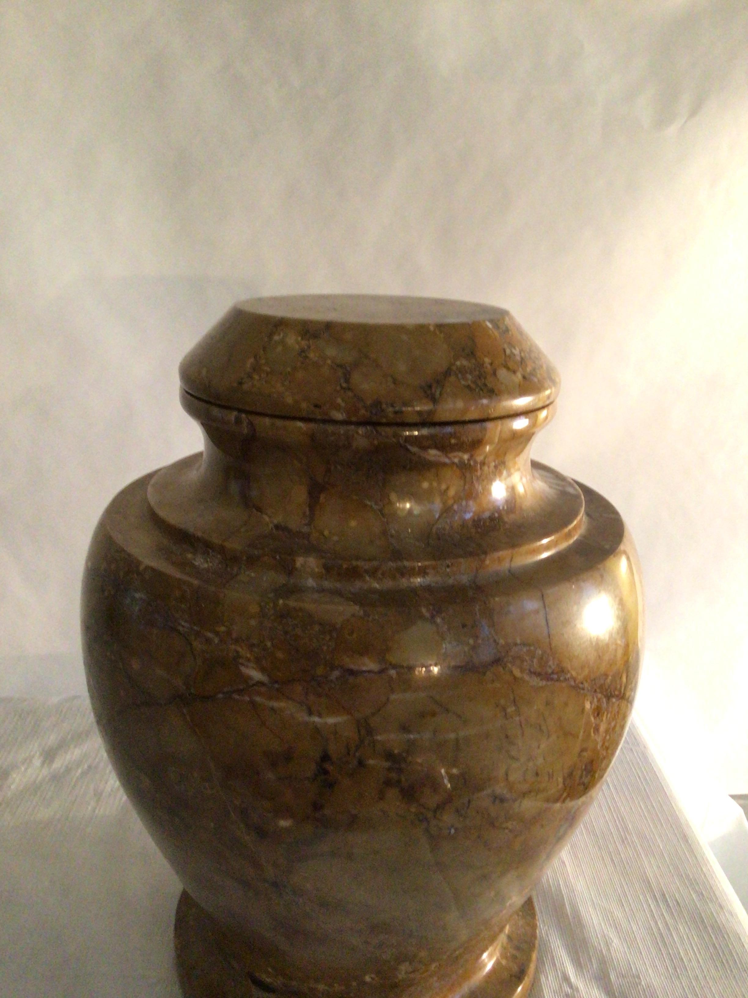 1970s Stone Jardiniere or Urn With Lid
The urn has varying shades of earth tones and pebbles that you expect to find on the shore and the stone means that you are getting a natural and unique item.