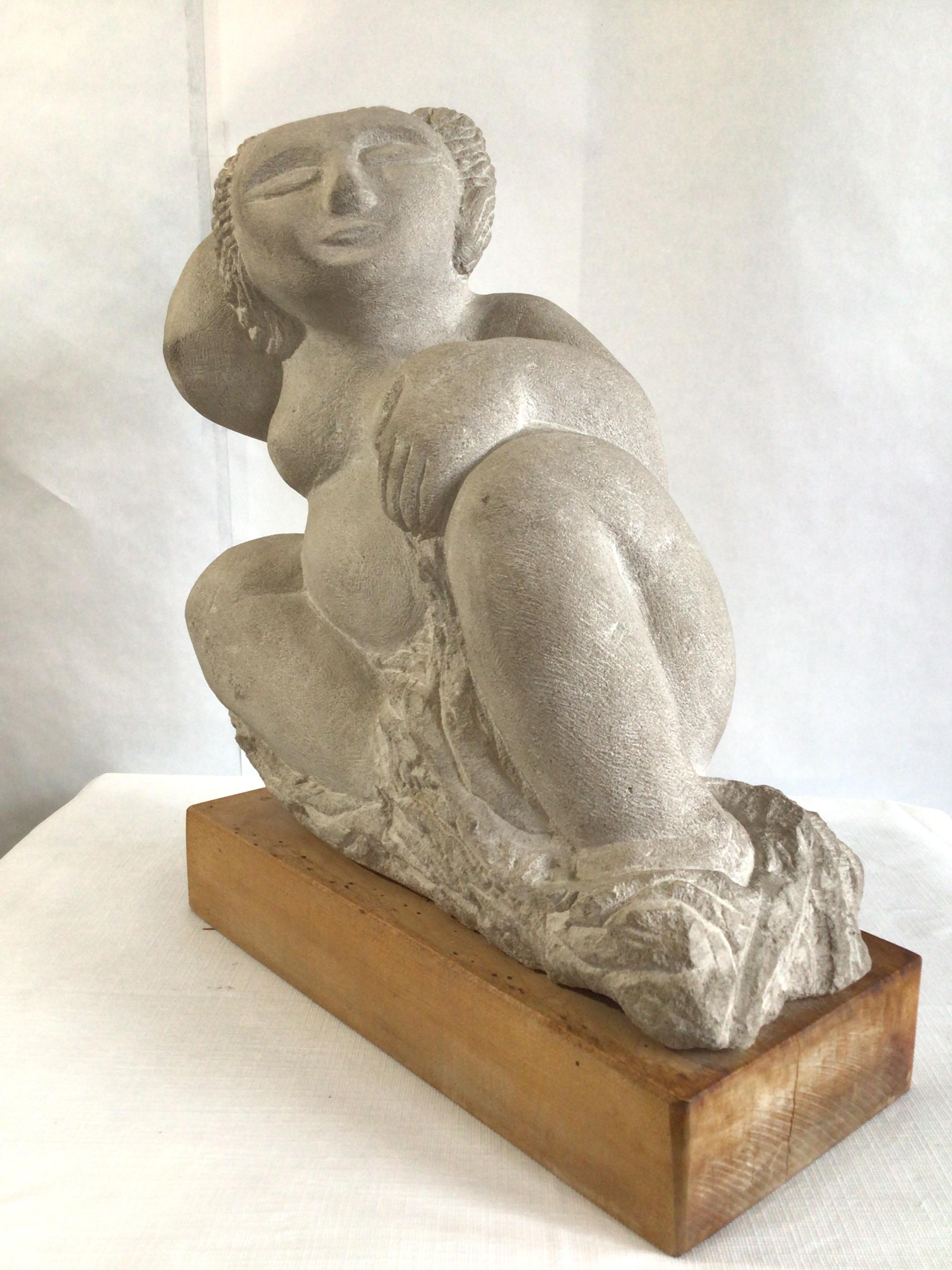 Beautiful 1970s stone sculpture of reclining voluptuous woman on a wooden base
Colors: White, Light Grey, Golden Wood.