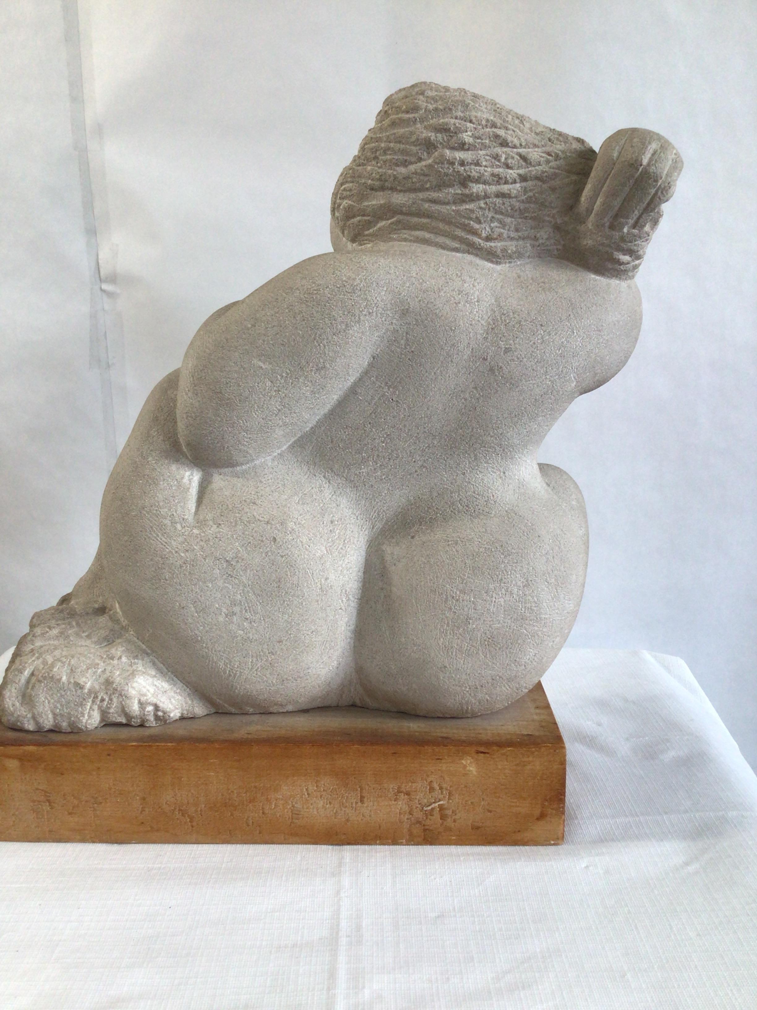 1970s Stone Sculpture of a Voluptuous Woman on a Wood Base In Good Condition For Sale In Tarrytown, NY