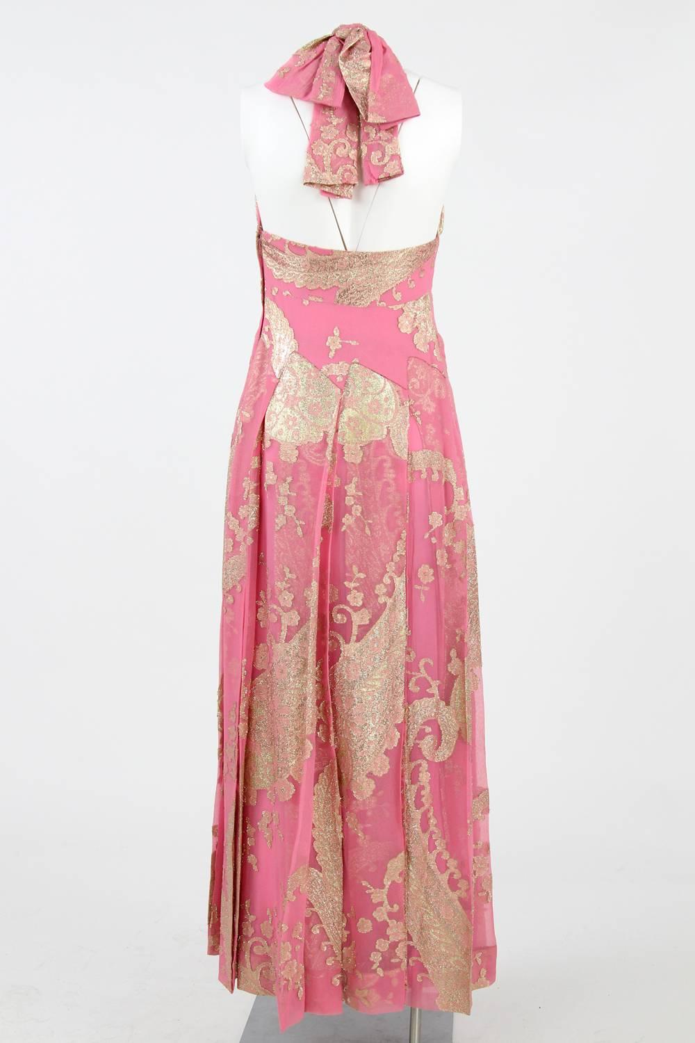 Amazing 1970s Stop Sénès Italian silk dress with golden lurex embroidered details, a deep neckline and an American lacing.

Measurements:
length: 147 cm
bust: 34 cm