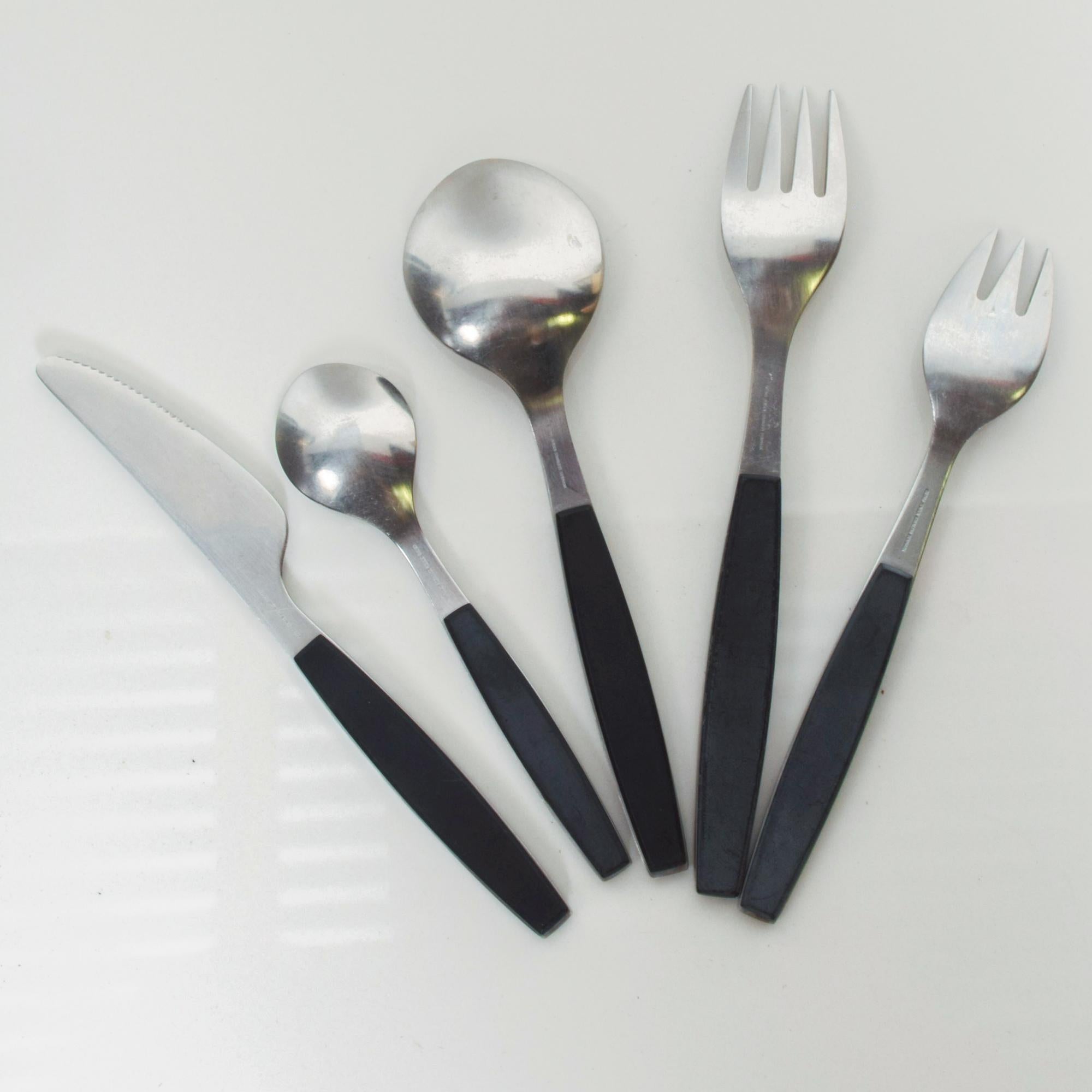 1970s modern Denmark midcentury: Strata-black stainless flatware place setting plastic black handle by Henning Koppel for Georg Jensen Co, Denmark

Dimensions: Knife 7