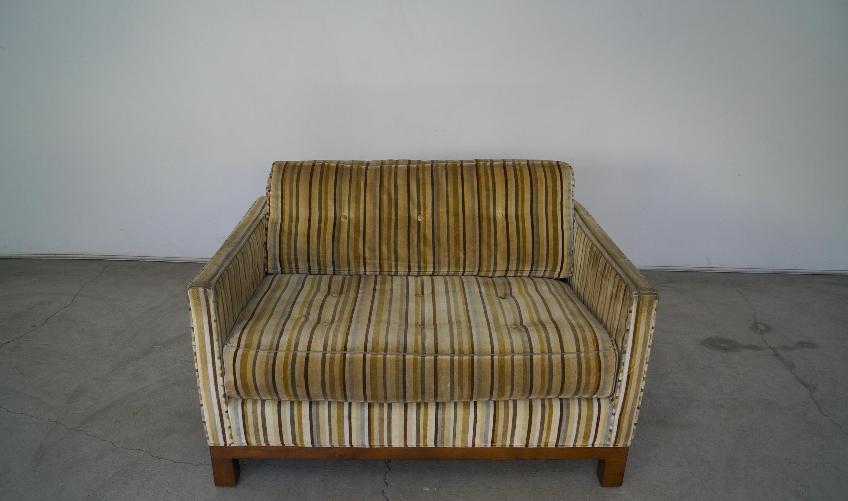 Vintage 1970s Mid-Century Modern compact couch for sale. Incredible small settee Size that is a two-seater. Very rare to have a sofa this Size. Very high-quality vintage sofa with a solid wood base frame in a walnut finish. It has the original