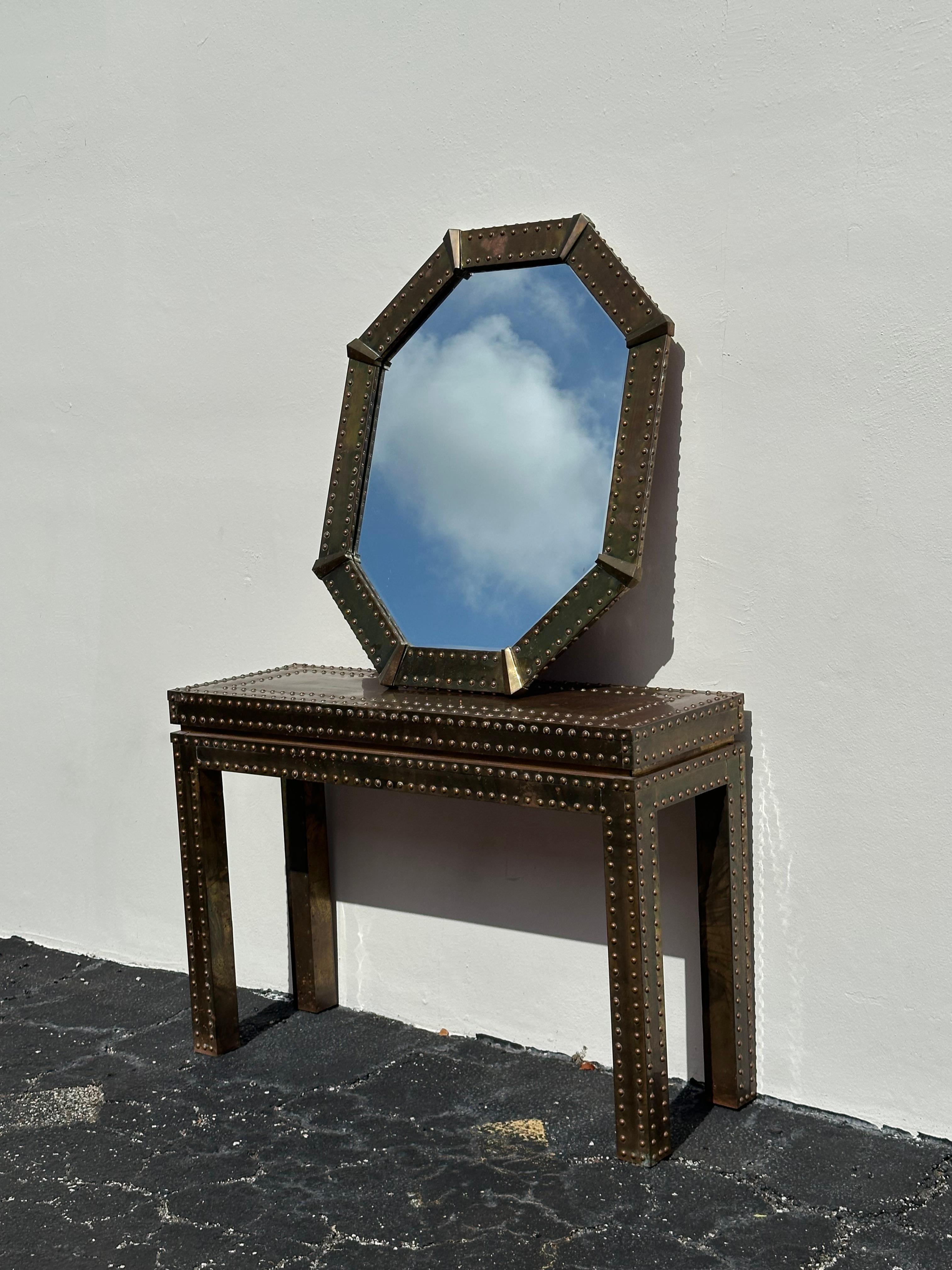 On offer on this occasion is one of the most stunning and rare, aged brass studded console and mirror you could hope to find. Outstanding design is exhibited throughout. The beautiful set is statement piece and packed with personality!! Just look at