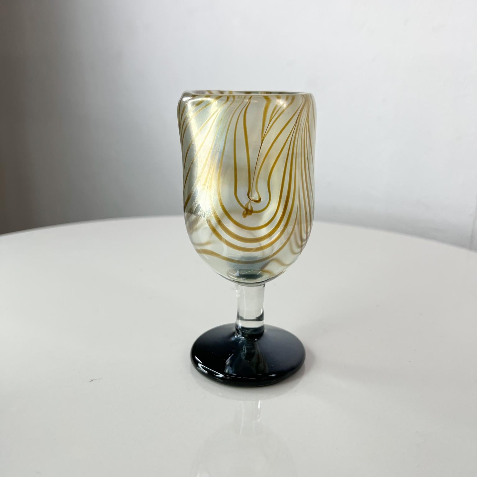 1970s Studio Art Glass Goblet handmade by California artist Norm Thomas
Signed at bottom hard to read.
Measures: 2.63 diameter x 5.63 tall.
Unrestored original vintage condition.
See images provided.

