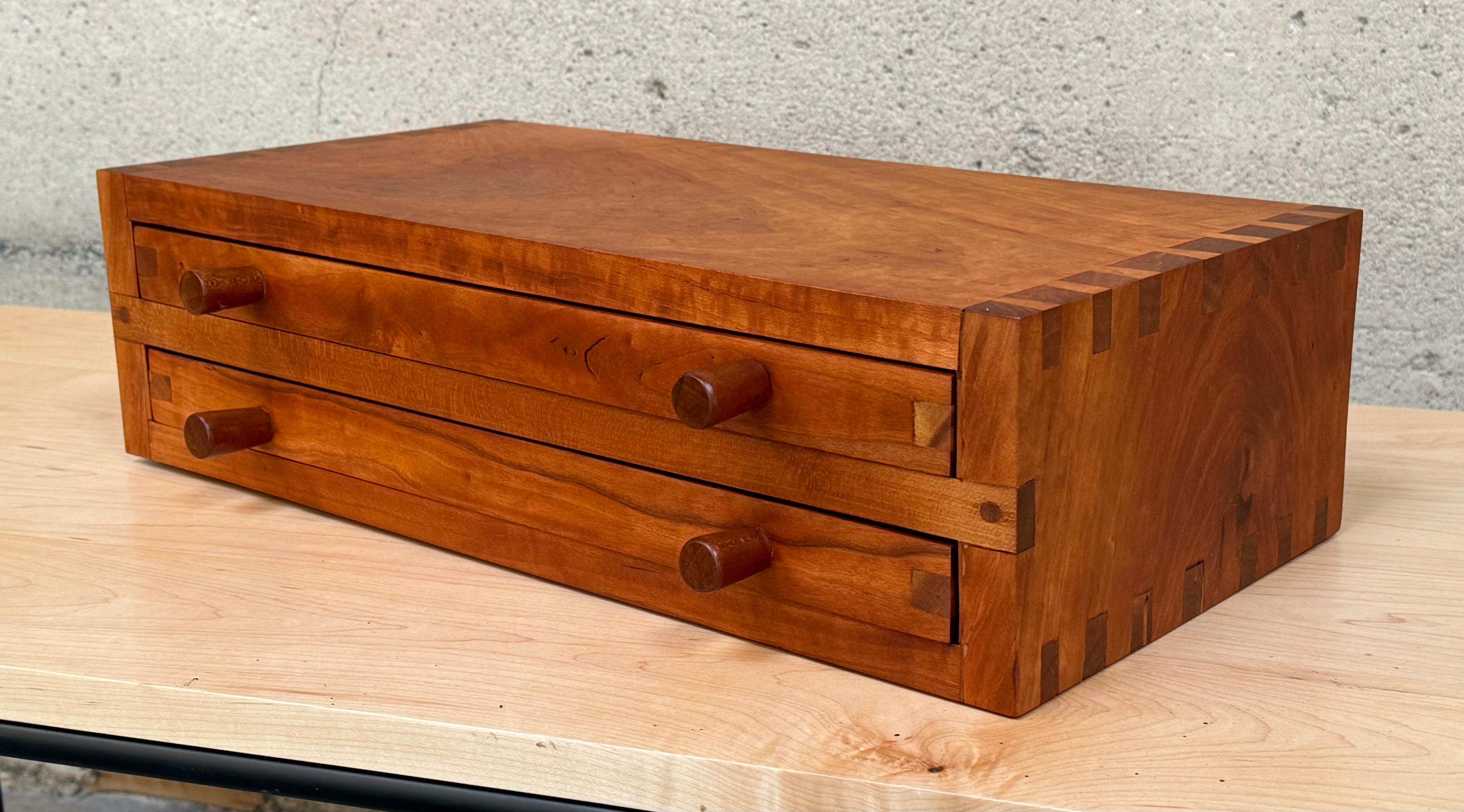 1970s Birds Eye maple jewelry box with two drawers with dividers to sort the jewelry pieces. Fine joinery throughout its construction and the Birds Eye maple has a rich color and expressive graining.