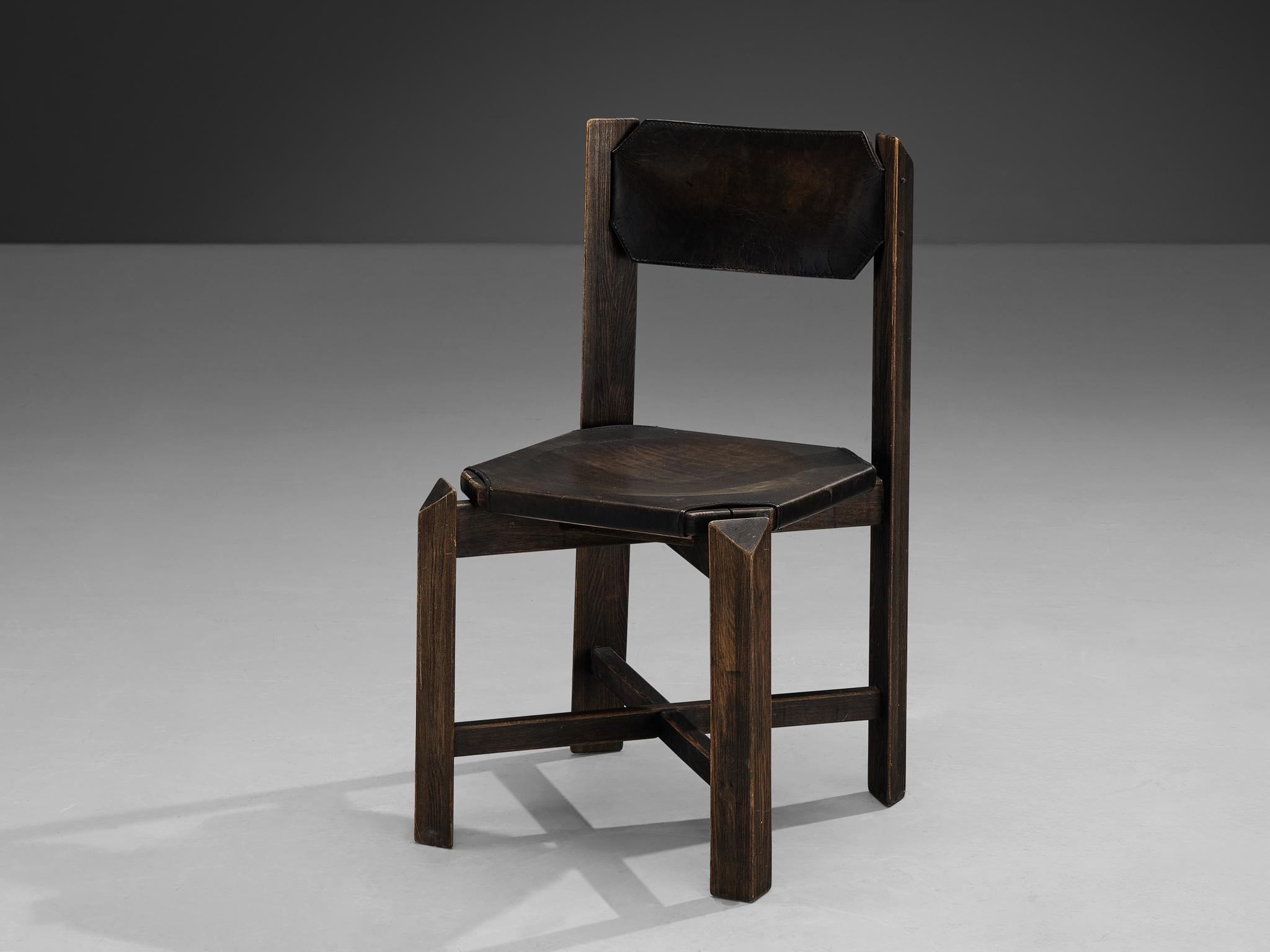 Dining chair, leather, beech, Europe, 1970s

This design shows a sturdy construction, featuring durable black leather upholstery complemented by a robust wooden framework. The architectural design showcases precise attention to detail, with linear