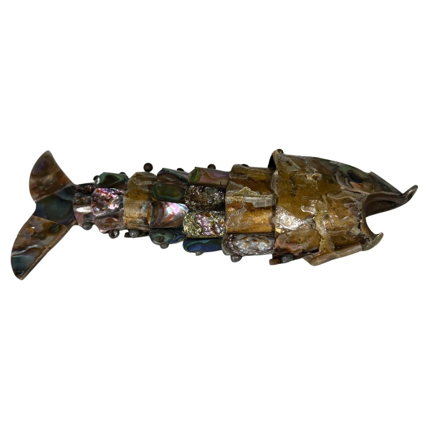 1970s Vintage fish bottle opener in Abalone Shell Mexico
Style of Los Castillo. Unmarked.
5.75 d x 1.75 h x 1 w
Missing some abalone pieces.
Preowned vintage condition.
See images posted please.