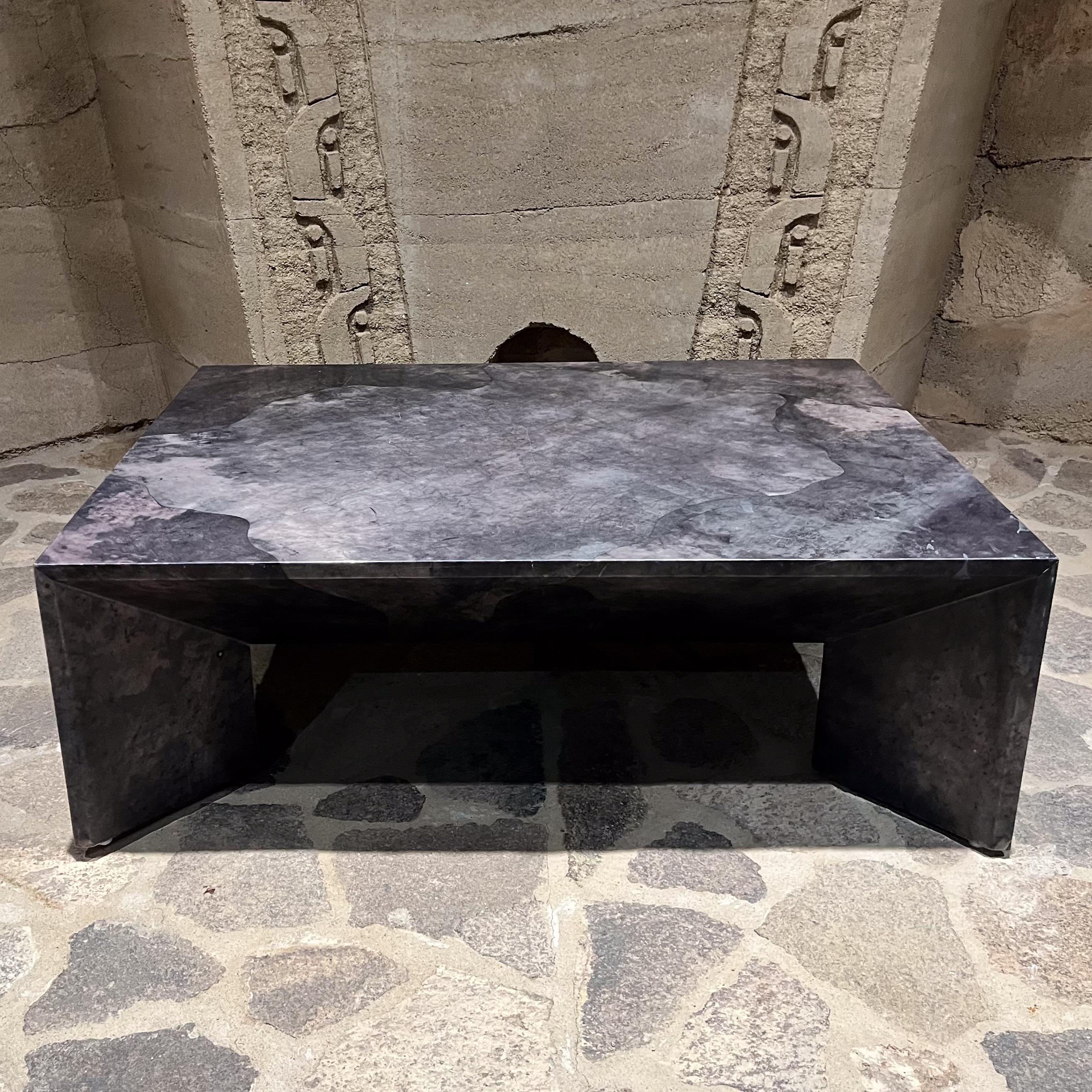 AMBIANIC presents
1970s Modern Goatskin Coffee Table. Rectangular shape with angled legs. Wood table wrapped in goatskin with grey tones. Finish with satin lacquer or polyester finish. It looks like carved out of single stone. Beautiful;