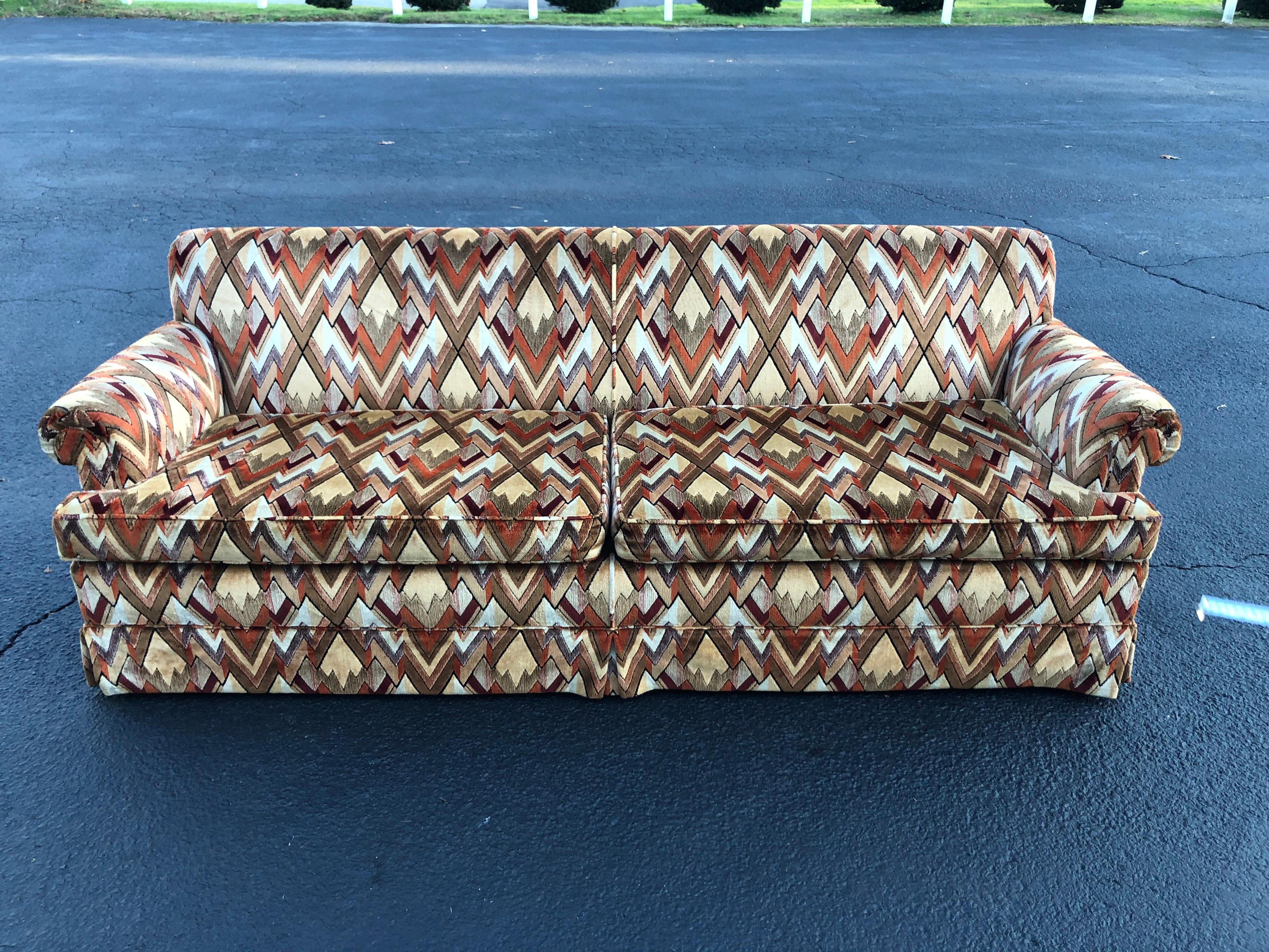 1970s style sofa in Jack Lenor Larsen Chevron fabric.Most likely Edward Wormley for Dunbar. This item is in mint condition. Barely used. Soft velvet like upholstery and Minimalist lines make up this mod beauty. Dealer shipping to NYC available .
