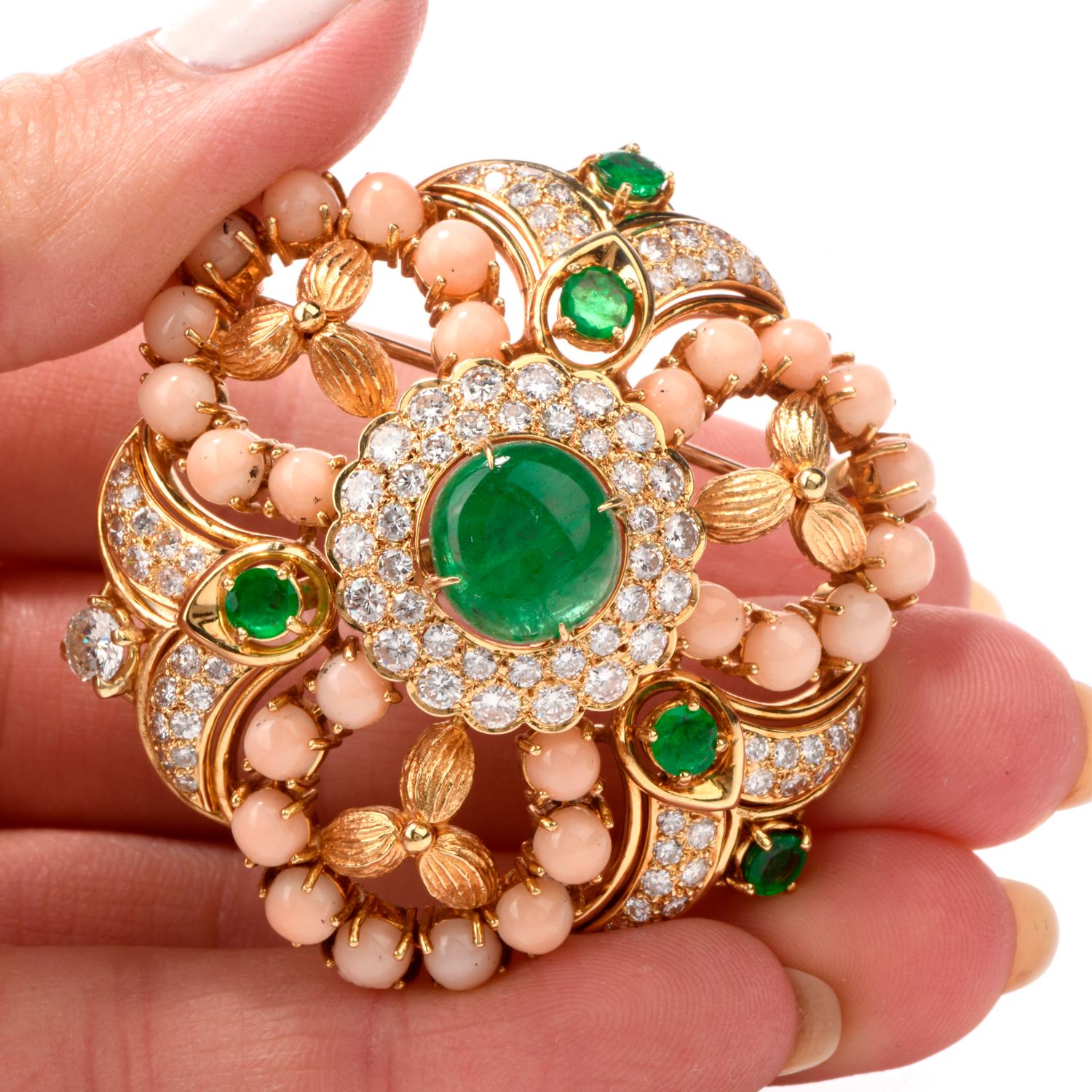  This Stylish coral Emerald and diamond Pin brooch is hand crafted in 18k yellow gold.

 Centered with a genuine cabochon emerald weighing approx. 3.20 carats,

surrounded by exquisite diamonds and natural angel skin corals and 4 round cut emerald.