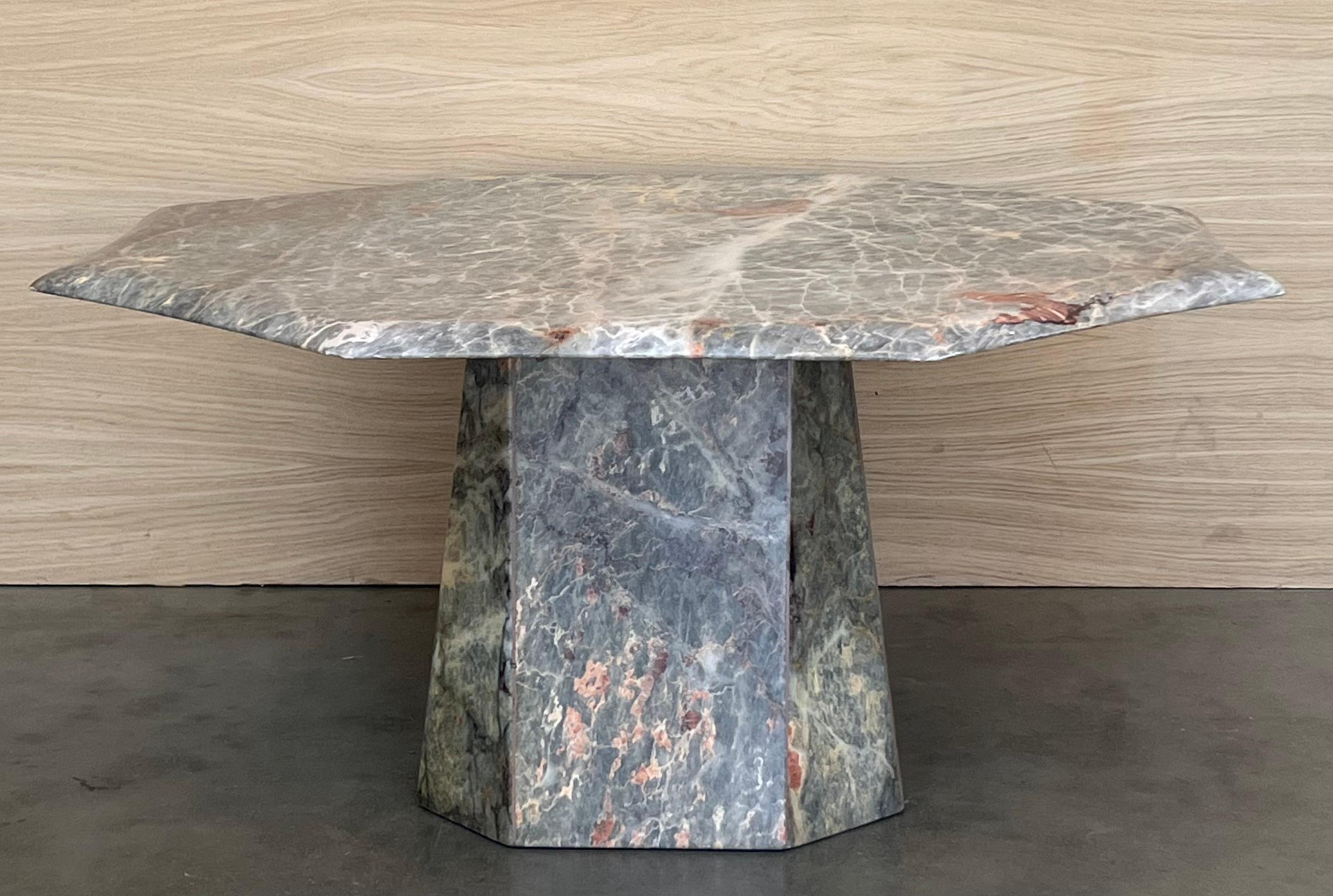Absolutely gorgeous octogonal marble coffee or cocktail table from the 1970s, in fantastic, virtually unused condition.  Features incredibly stunning sculptural bases. The top comes off from the bases for safer shipping. The marble veining is