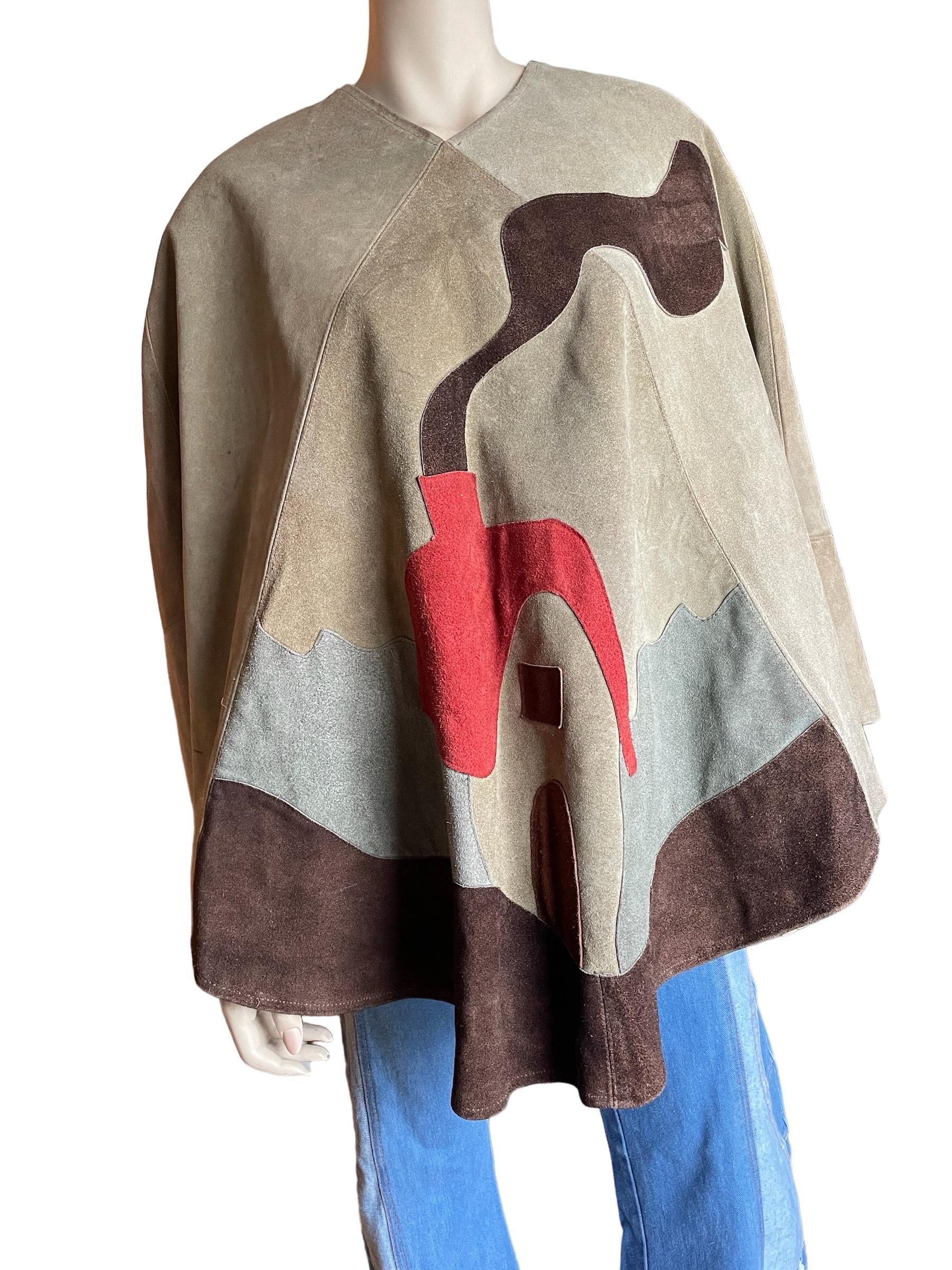 1970s Suede Patchwork Poncho 

Amazing 1970s suede patchwork poncho with smokey house scene. A one of a kind piece from the 70s. Amazing patchwork in the design of a mystical house with a smokey chimney. Slight distress on the back seam and small