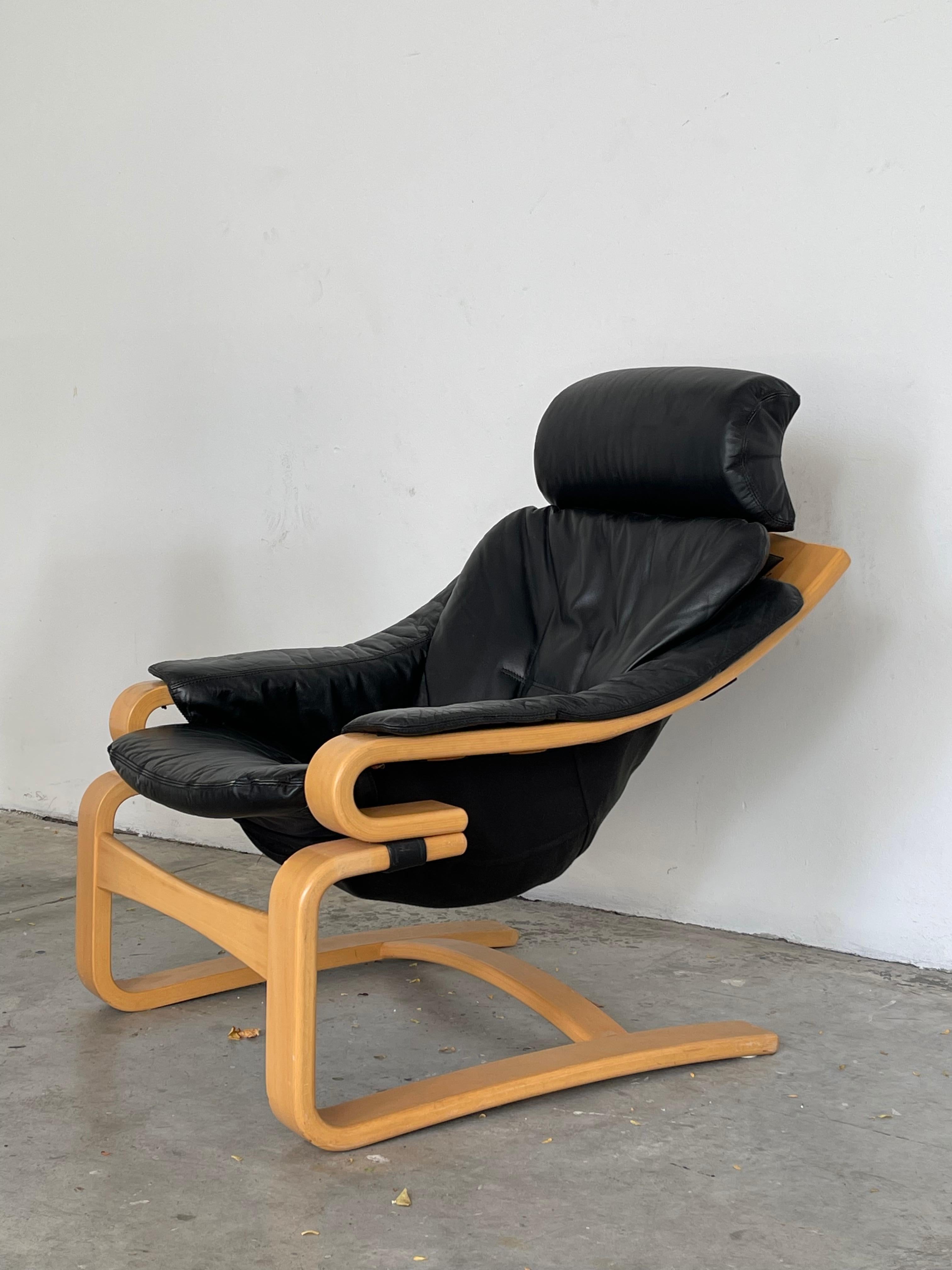The 1970's Svend Skipper ?'style' Apollo chair and ottoman for Skippers Mobler was an iconic Scandinavian design made from a sturdy bent plywood frame and a canvas/faux leather bucket seat. It has a low cantilever profile with a comfortable body and