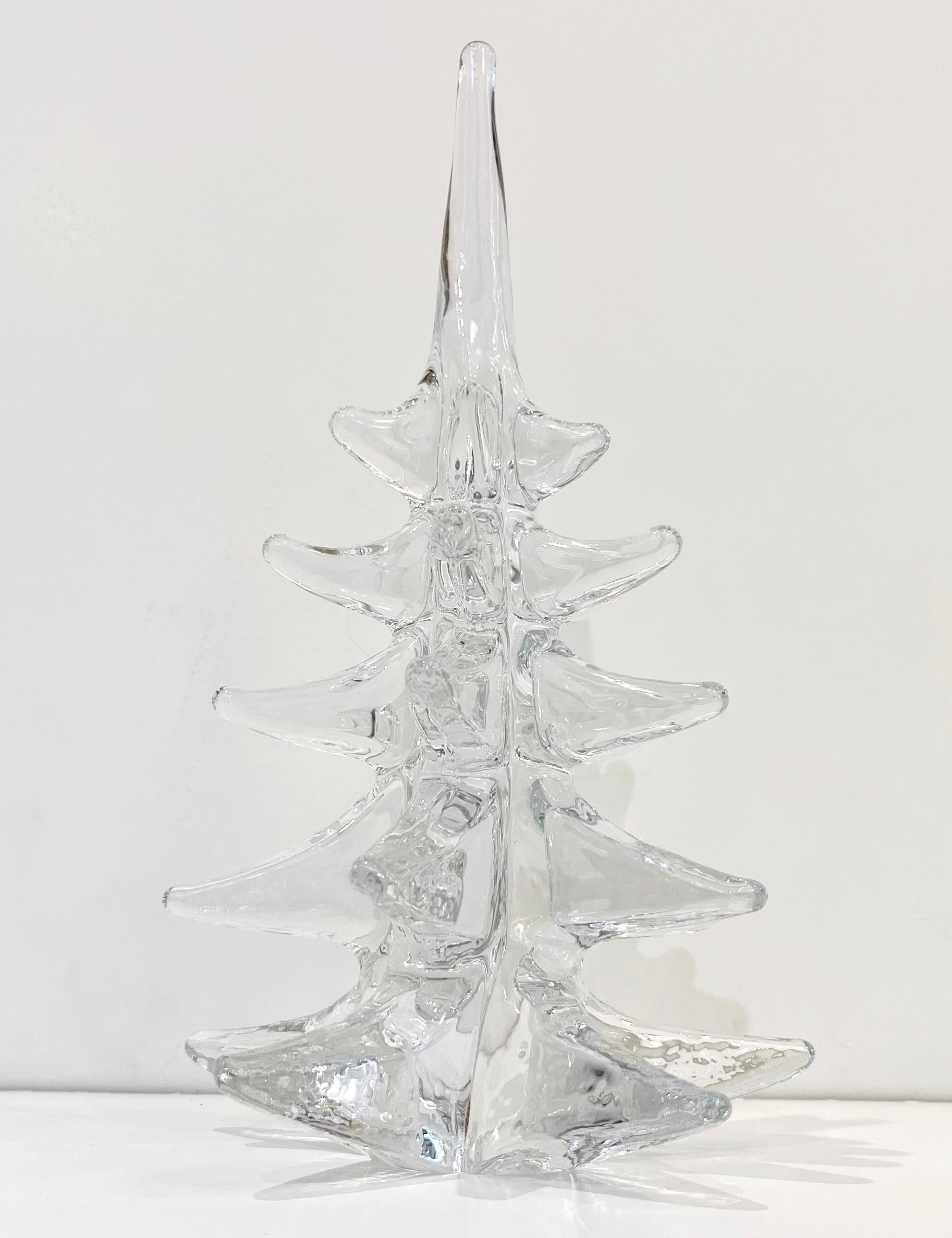 Crystal fir tree of organic sleek modern design, a vintage creation signed with etched FM Ronneby Sweden, individually handcrafted. High-quality crystal worked with spikes, creating flowing pine-like branches. It can be accompanied by a smaller one,