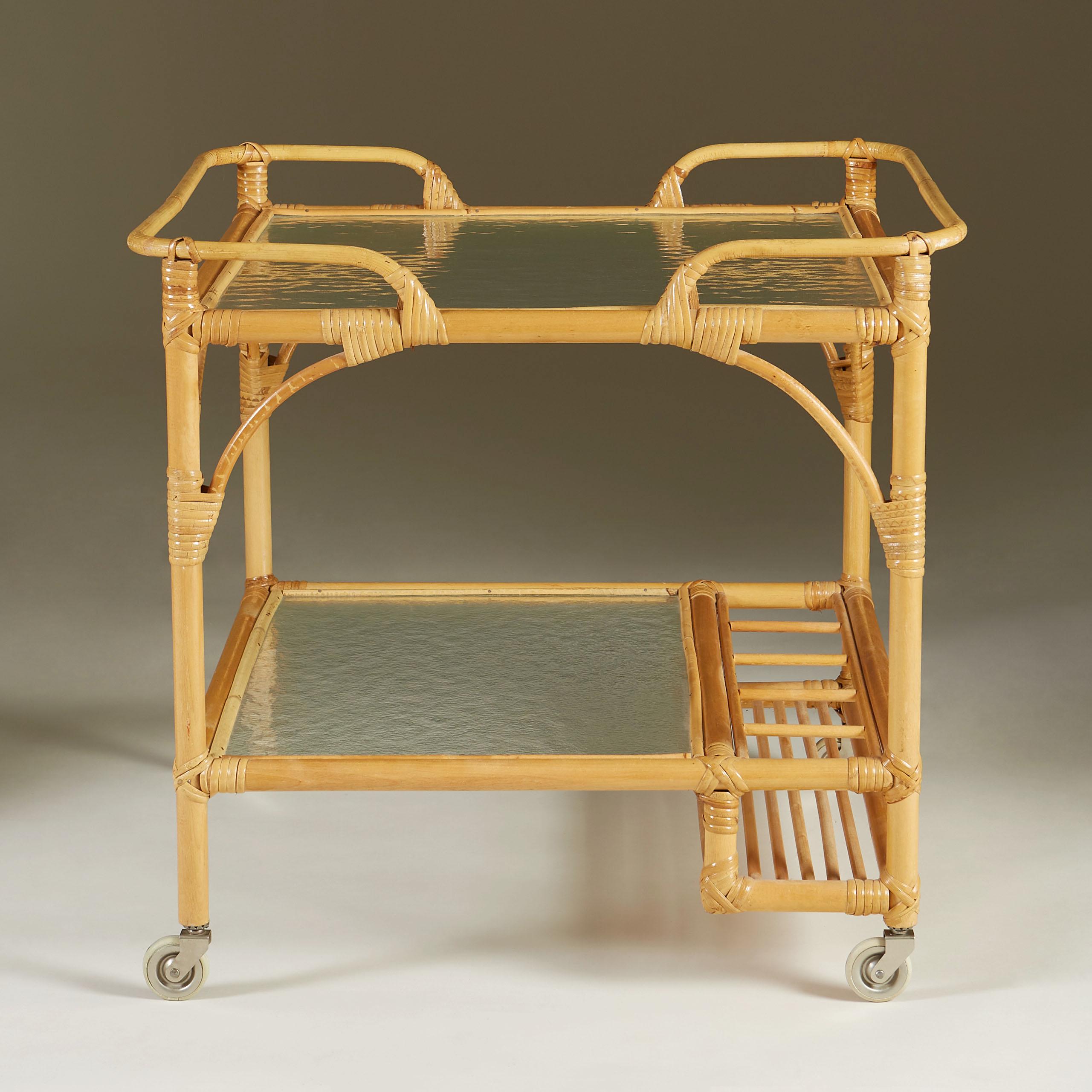 Two-tier serving trolley with glass shelves and useful 5 bottle holder. Sits on castor wheels for ease of movement.