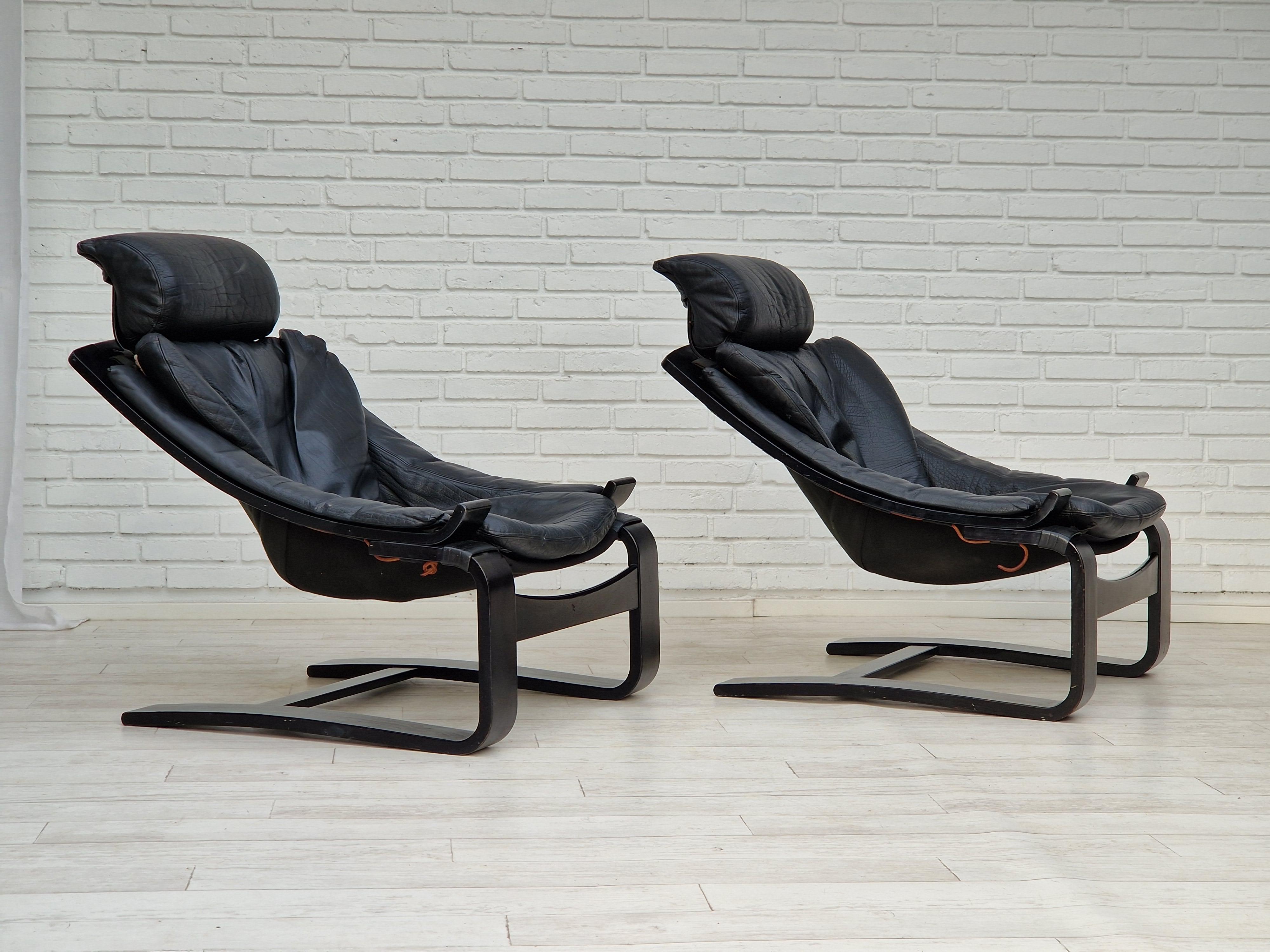 70s, Swedish design by Ake Fribyter. Set of two Kroken lounge chair. Original upholstery in black leather. Removable headrest and seat with backrest. Adjustable headrest. Original very good condition. No smells, no stains. Manufactured by the