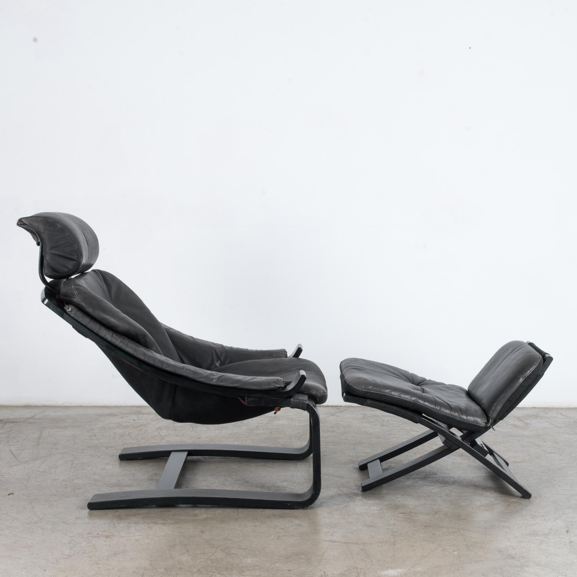 Late 20th Century 1970s Swedish Kroken Black Leather Armchair and Ottoman by Ake Fribytter