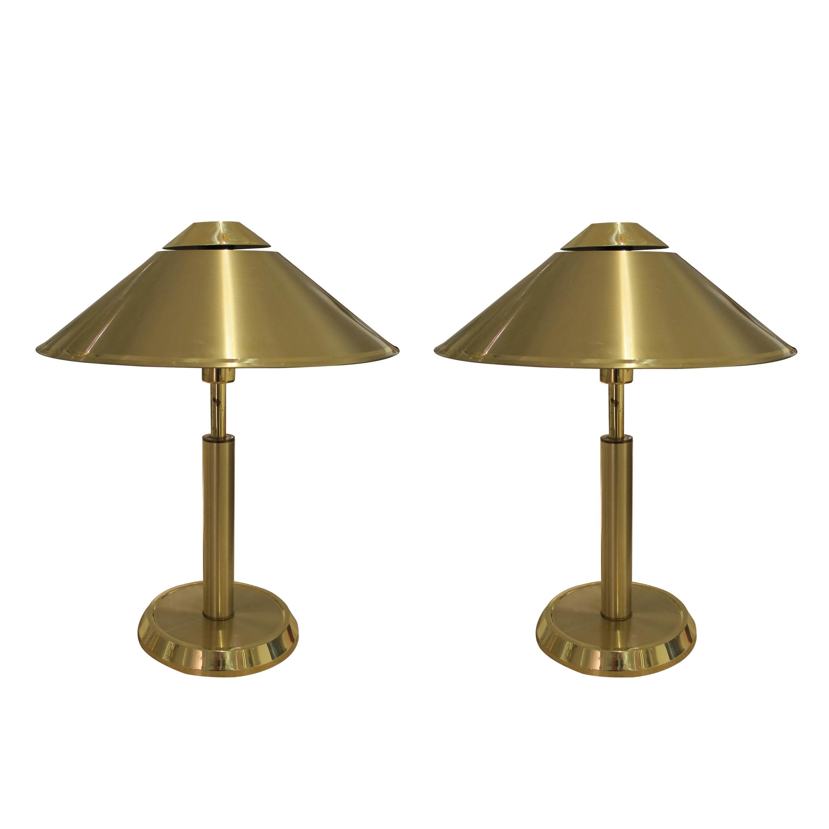 A stunning 1970’s very large pair of brass Swedish table lamps with conic lamp shades. The shape of the shades cast a really warm and beautiful diffuse ambient light. These structural lamps are ideal to create a visual and warm atmosphere. The lamps