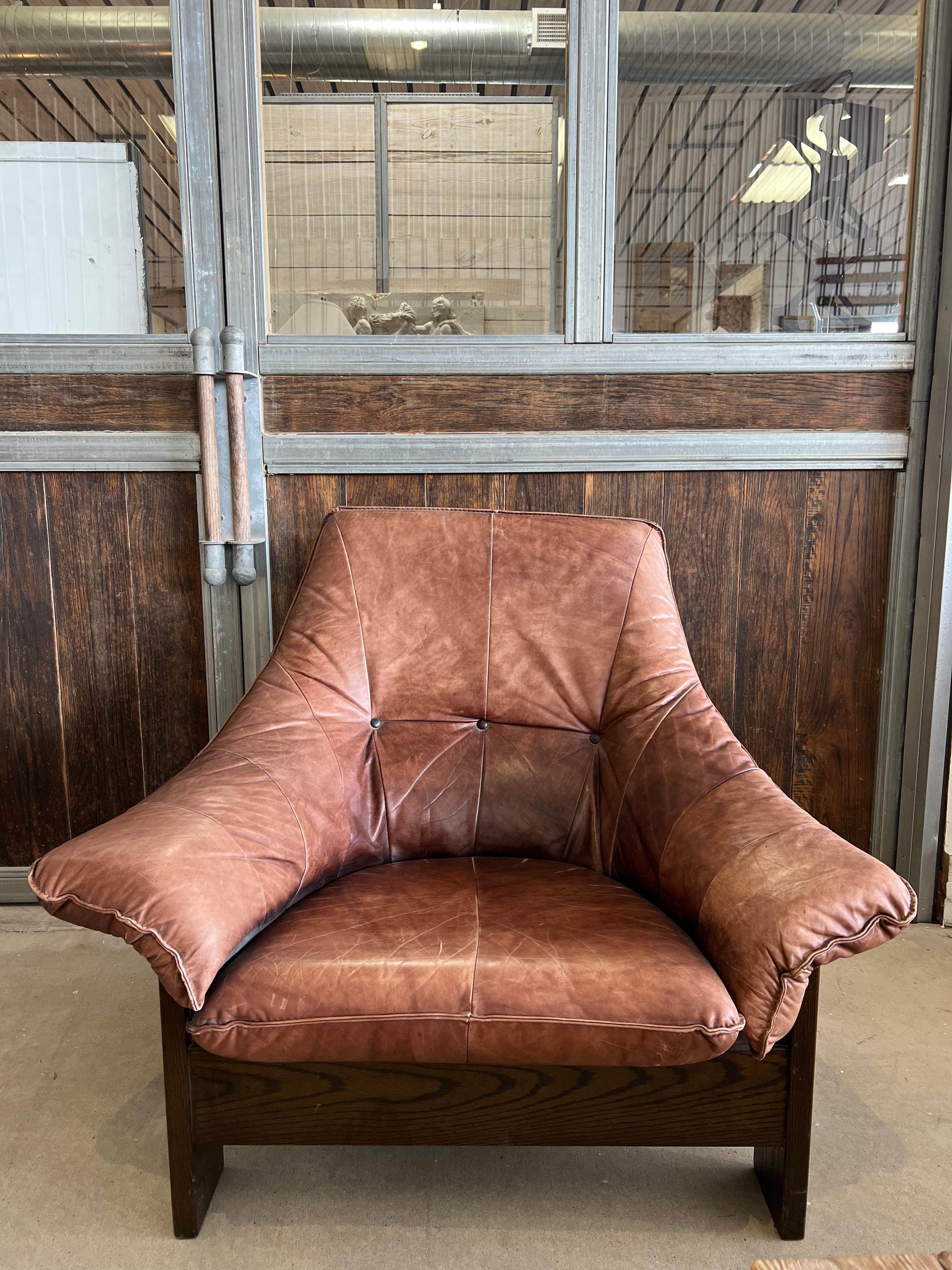 Postmodern Swedish leather lounge chair with wood base.