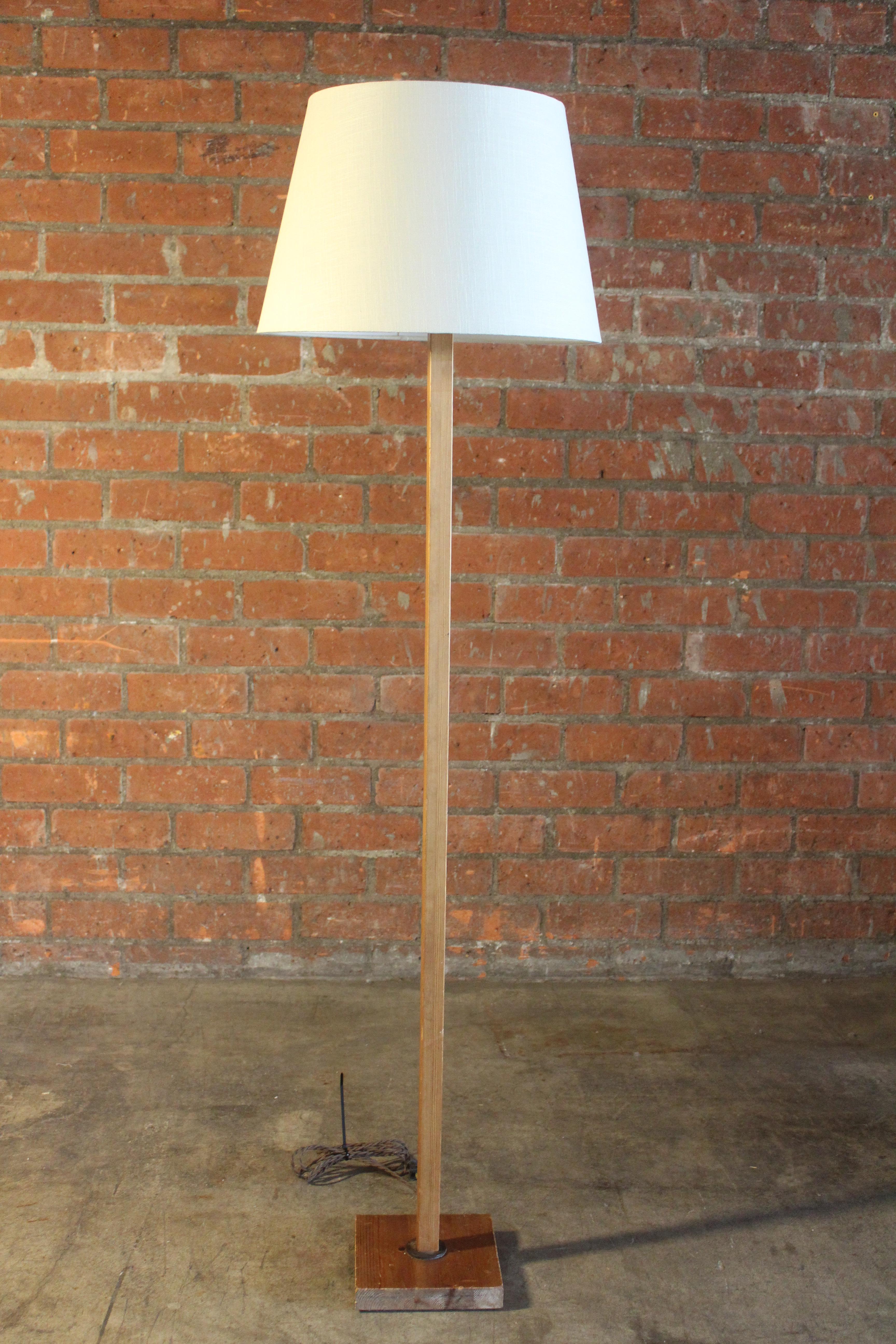 A vintage 1970s Swedish pine floor lamp. Newly rewired with a custom made shade in linen. The wood finish shows minor signs of wear.
Measures: Base is 8.25 x 8.25 and overall height of 66