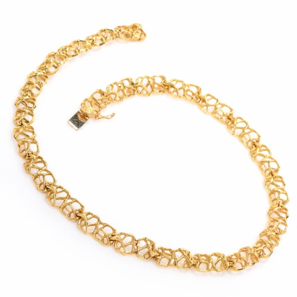 This alluringly delicate Vintage necklace from Gubelin Swiss with openwork asymmetric pattern is handcrafted in solid 18K matted and finely nugget textured yellow gold. Weighing approx. 35.1 grams and measuring 14.5 inches long and 7 mm wide. This