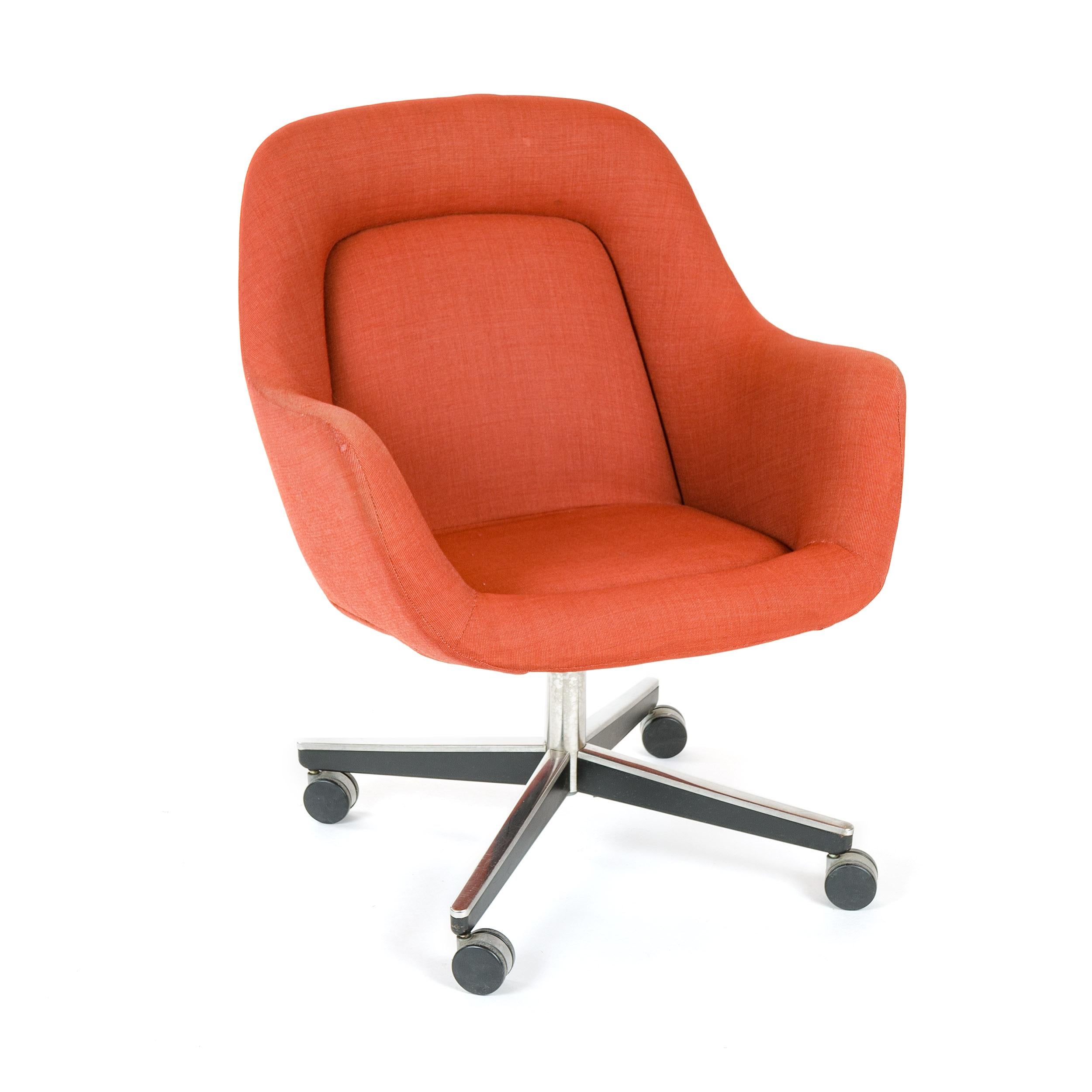 A desk chair with the original channel-stitched upholstery, on an X-form caster base.
   