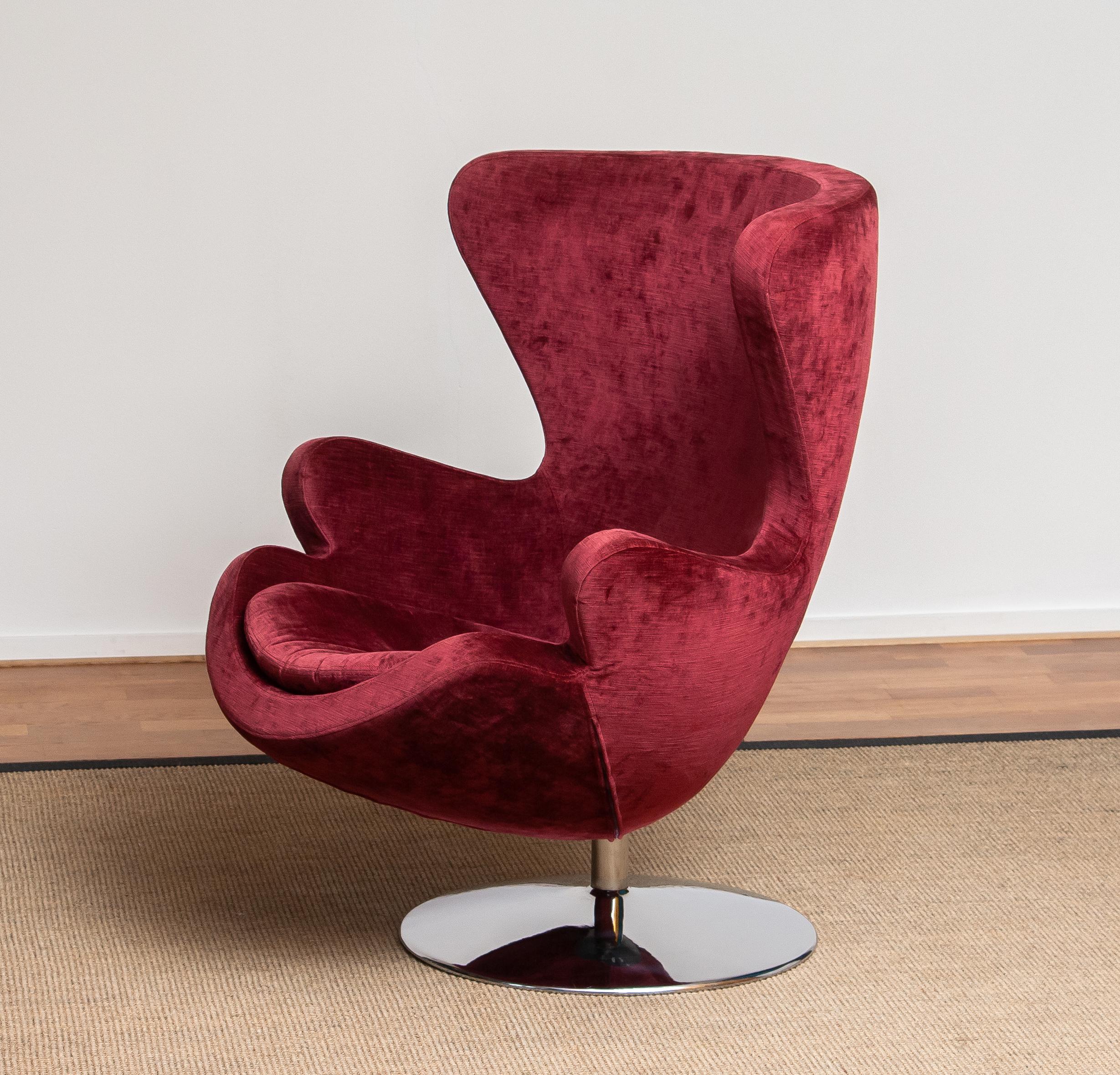Swedish 1970s, Swivel Lounge Egg Chair on Chrome Stand Colored in Bordeaux Red Baby Roy
