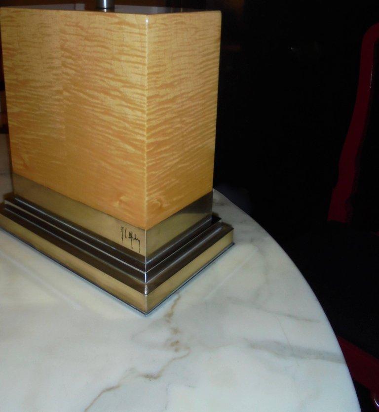Massive polish piece of maple on a brass base (gold and silver). One light. Original silk Pagoda shape lampshade. Signed.