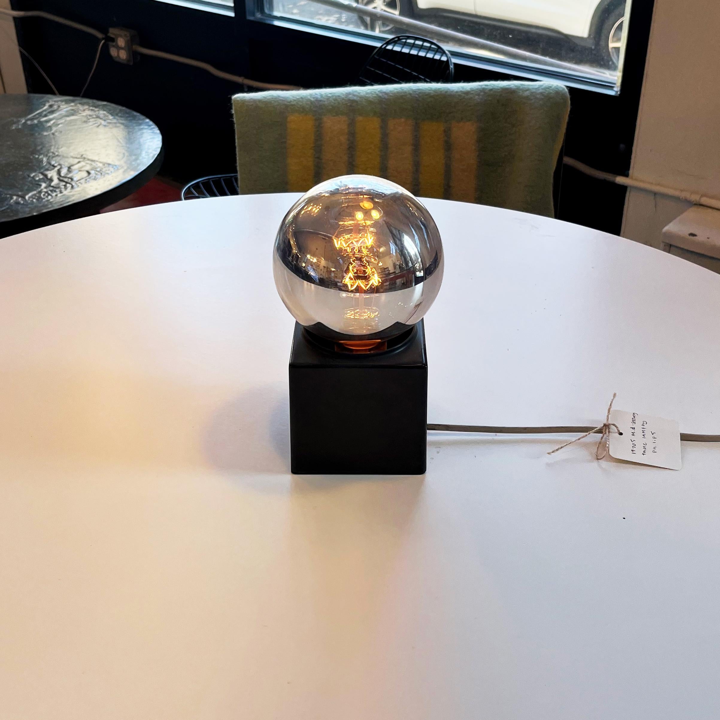Illuminate your space with a piece of design history! Presenting the Space Age Table Lamp from Philips, circa 1970s. Embrace the futuristic charm of mid-century modern aesthetics. This iconic lamp is not just a light source; it's a statement piece.