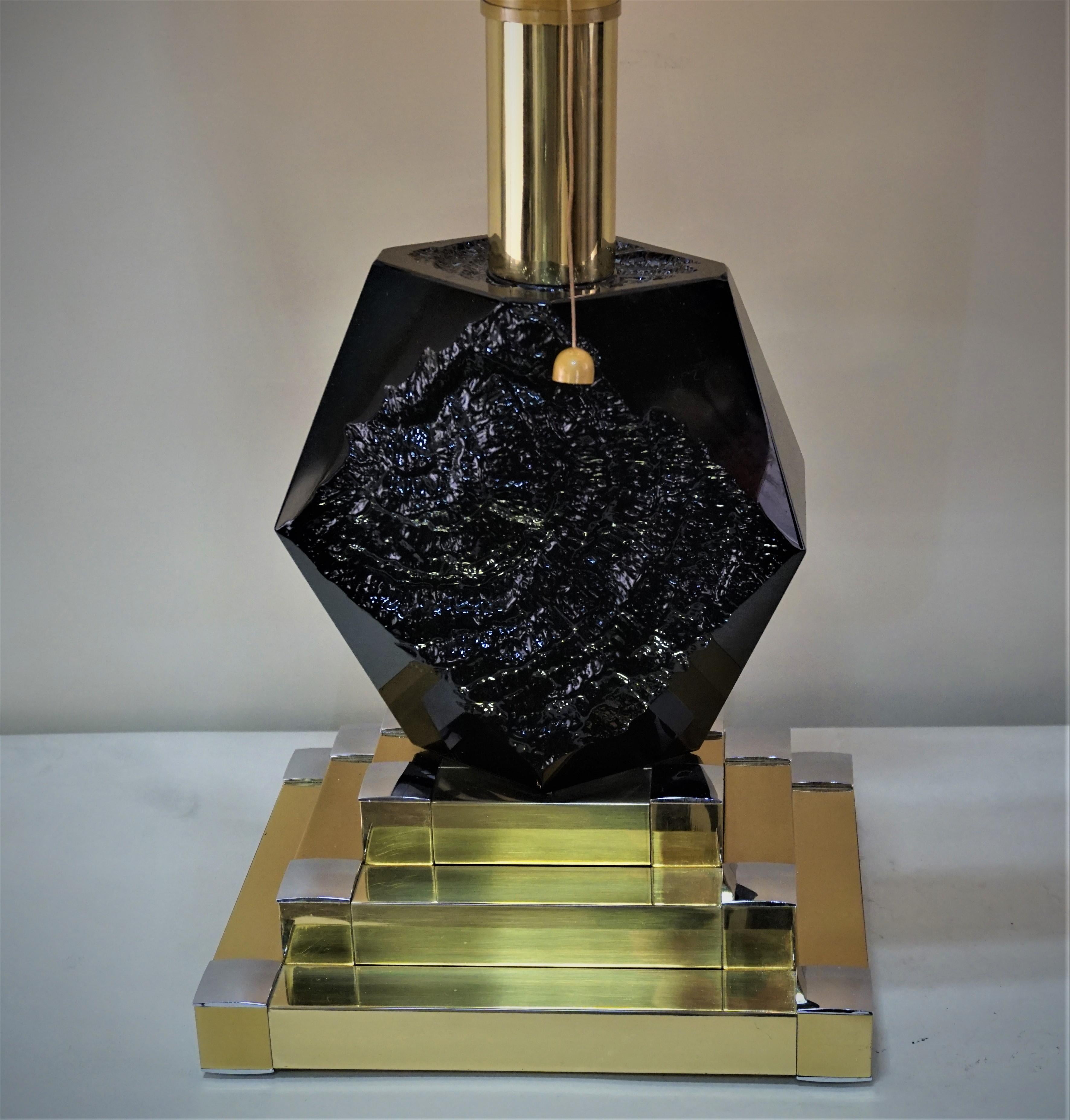 Heavy cased black glass fitted with chrome bronze base table lamp.