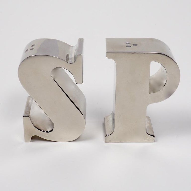 A fun pair of salt and paper shakers fashioned into the letters S & P and finished in silver plate.