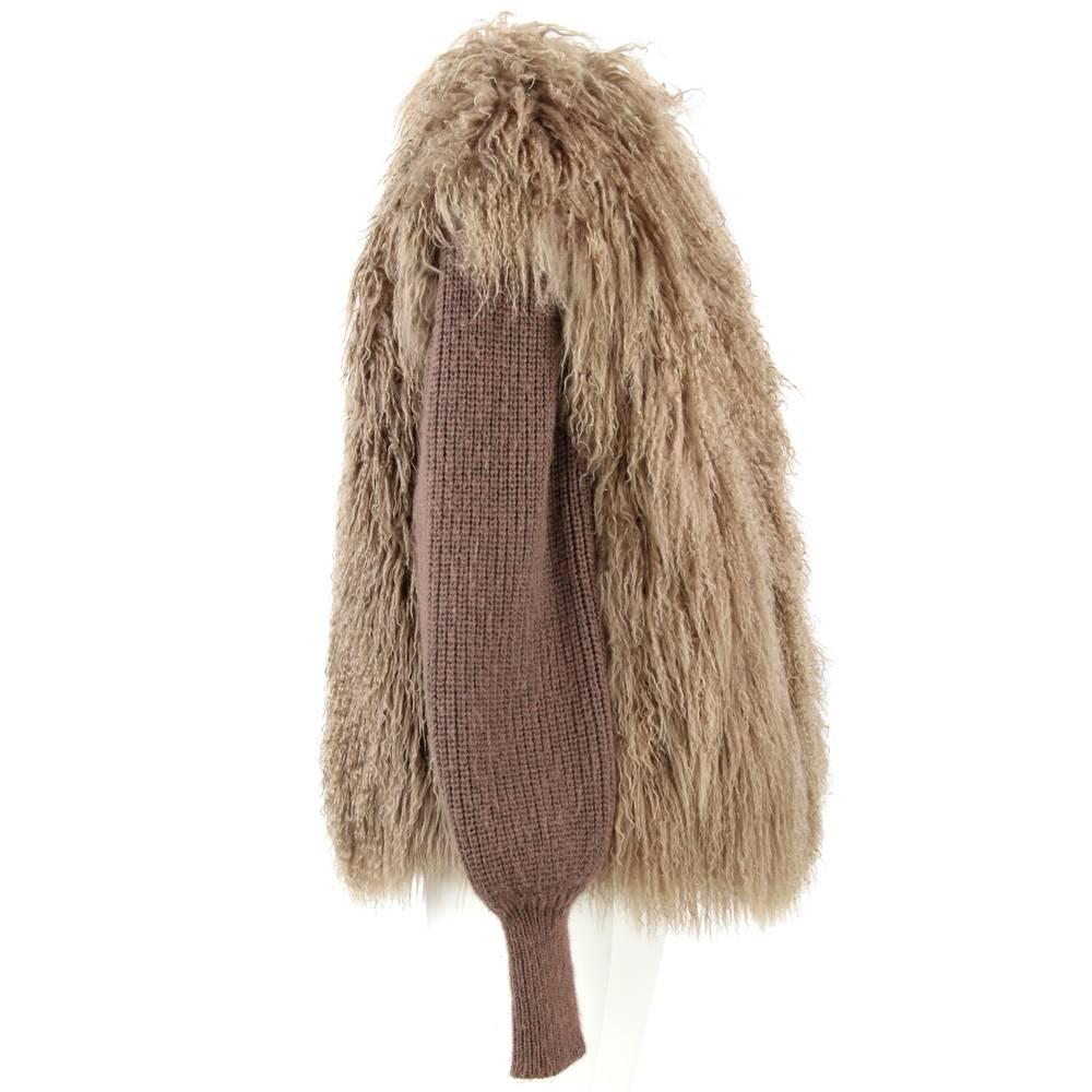 Warm tailoring brown jacket in mongolia fur. Sleeves are detachable by a zip to turn it into a glamour vest. Opened on the front features two internal pockets and two external ones. Lined. 
Height: 75 cm
Bust: 52 cm
Shouders: 43 cm
Sleeve: 73 cm